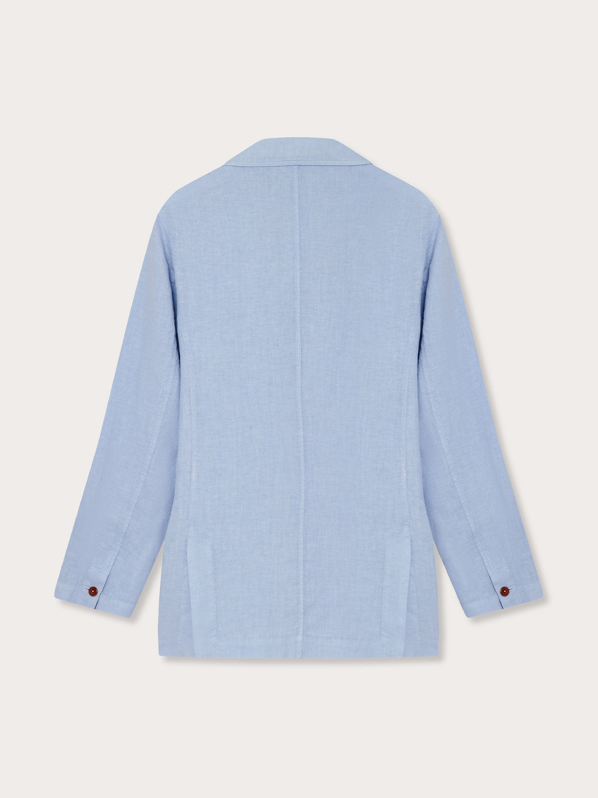 Men's Sky Blue Nassau Linen Jacket, back view. Men's linen jacket showing lightweight and unstructured design with corozo nut buttons.