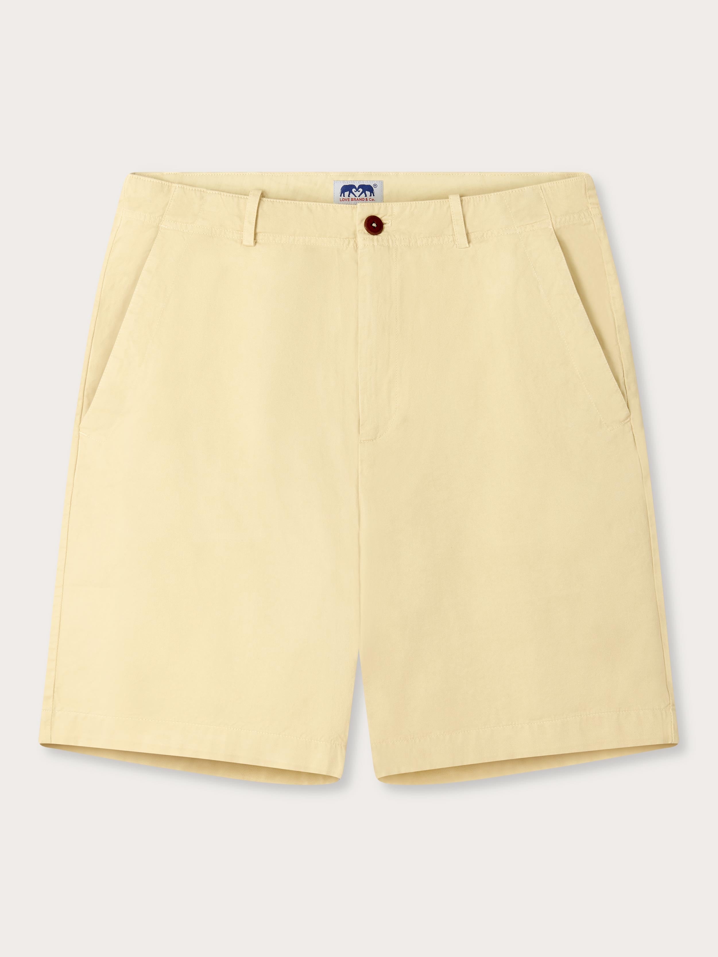 Men's Stone Harvey Cotton Shorts made from soft-touch organic cotton twill, featuring classic design and corozo nut buttons. Beige shorts made from 100% cotton.
