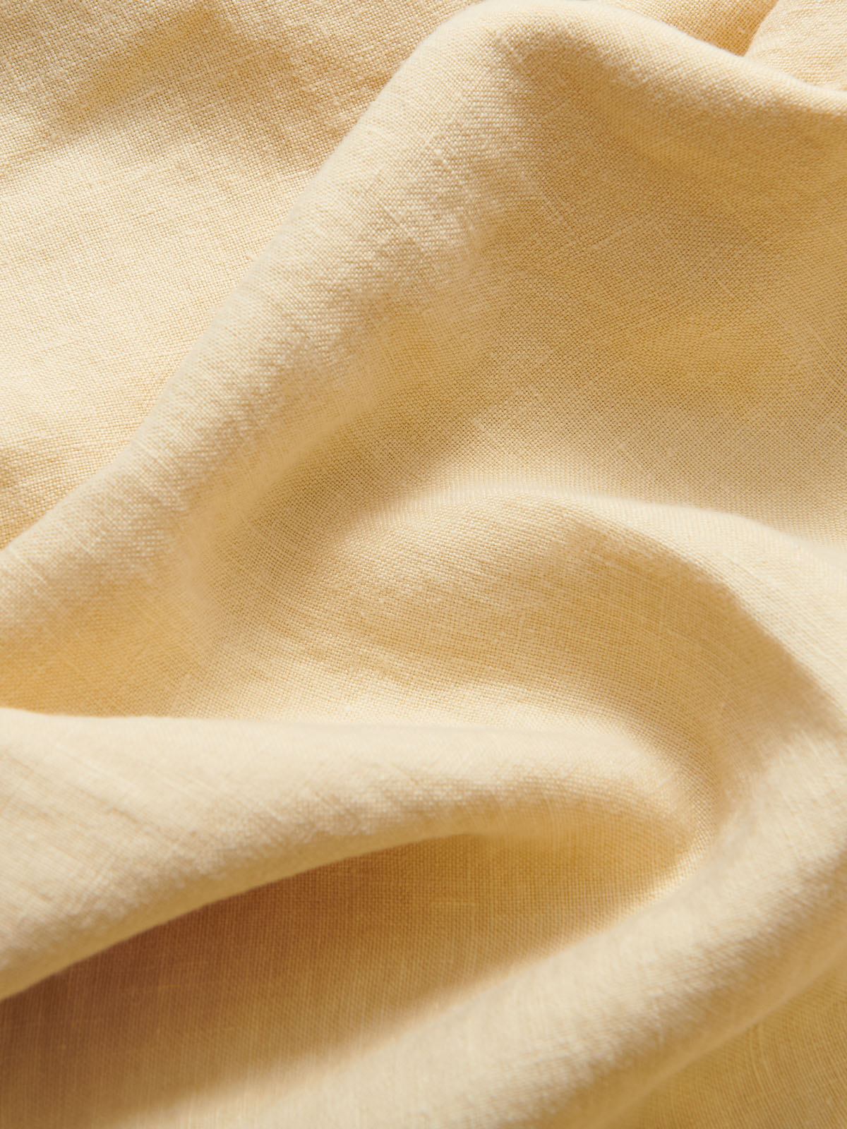 Close-up of the natural stone-coloured linen clothing for men. Old money style men's clothing.