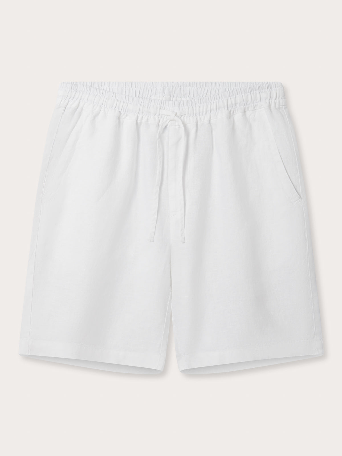Front view of Men's White Joulter Linen Shorts. Classic white linen shorts for men with a drawstring waist and 2 front pockets in a relaxed fit. Mens linen shorts in white.