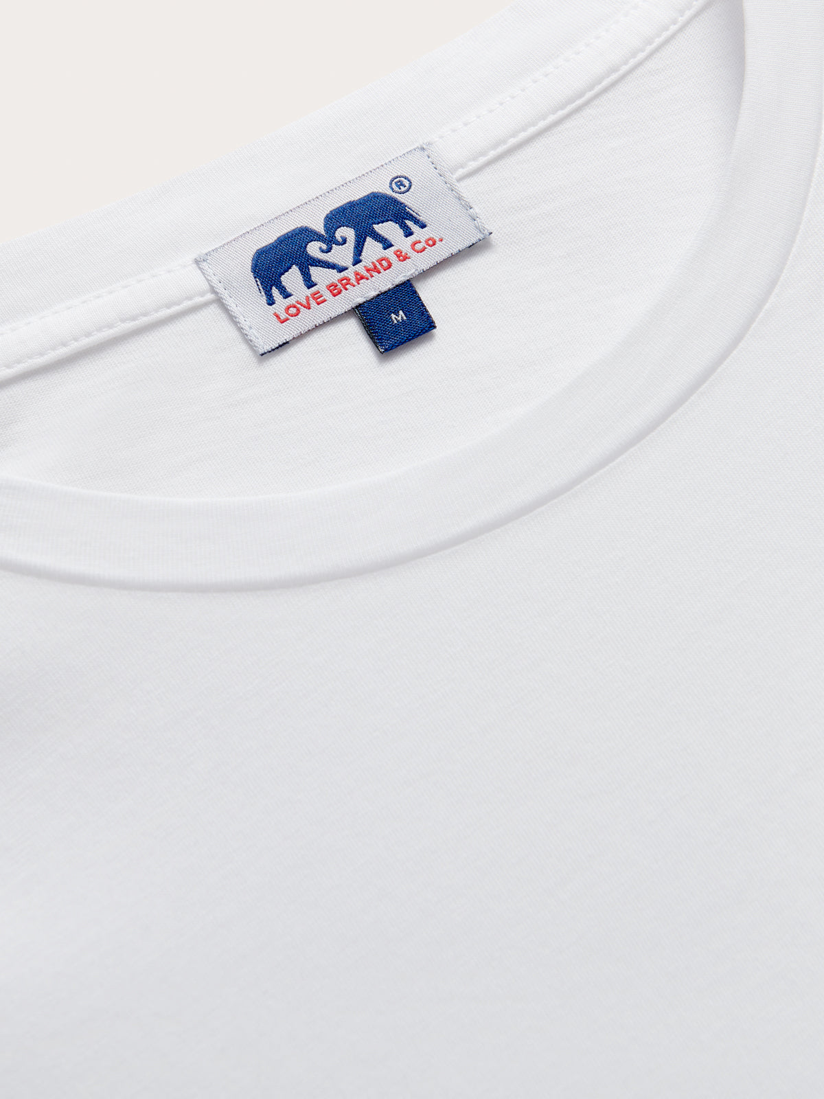 Men's White Lockhart T-Shirt displaying the brand label on the collar from Love Brand & Co.