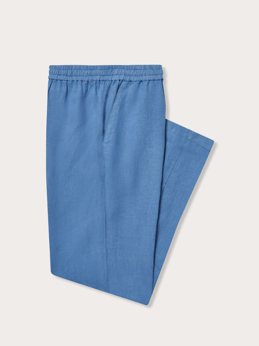Men's Deep Blue Eleuthera Linen Trousers. Navy blue mens linen pants with drawstring waist, tapered bottom, and side pockets.