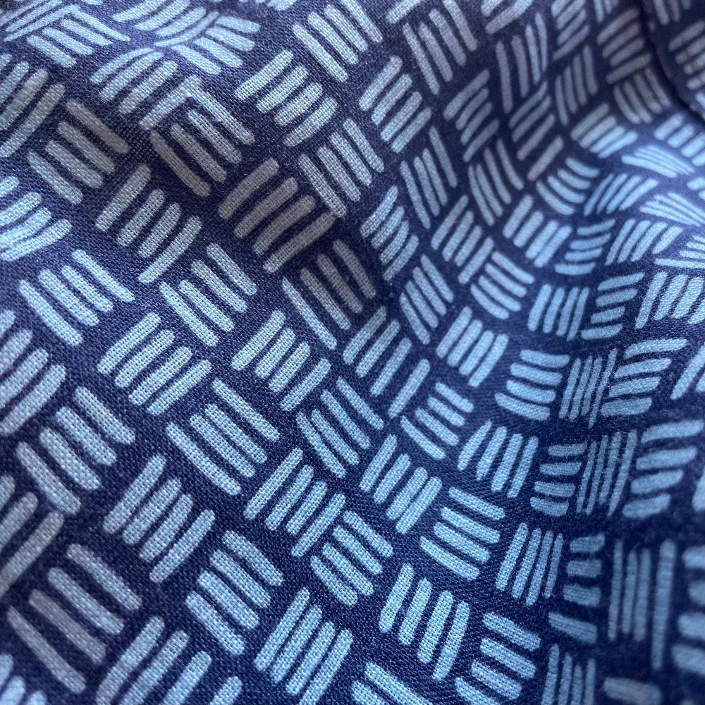 Pattern close-up of the Men's Sea Weave Abaco Linen Shirt, featuring a design inspired by the Posidonia seagrass meadows in Ibiza.