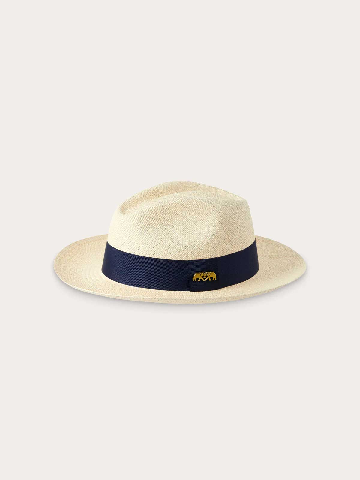 Side view of Kamalame Panama Hat with Navy Blue Band showing signature embossed elephant pin.