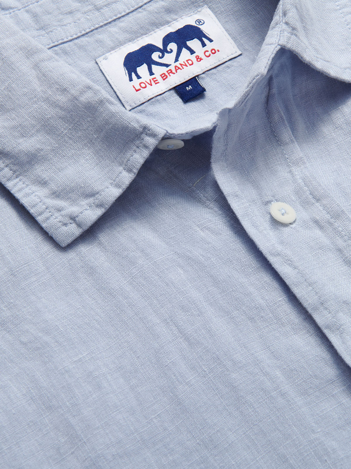 Sky Blue mens Linen Shirt detailed view showcasing love brand label.