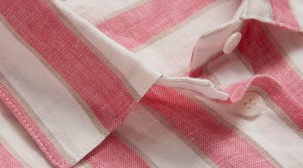 Close-up of a pink and white striped shirt from love brand's resort apparel collection