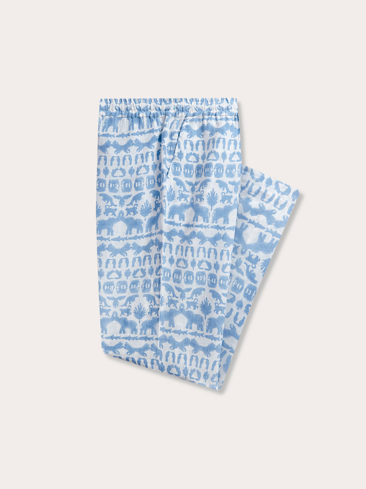 Unisex Eleuthera Trousers - Coexist, made from 100% premium Belgian linen. Unisex linen trousers with a sky blue print featuring animals of the Indian jungles such as elephants, tigers, and hornbills.