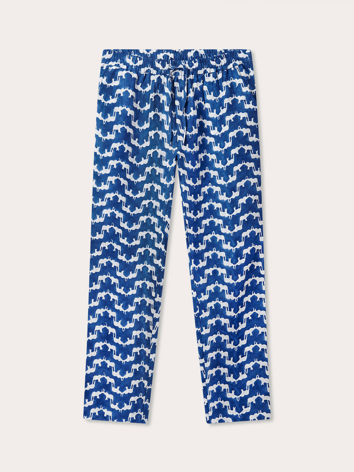 Navy blue linen trousers featuring a blue and white block print pattern of Asian elephants forming an illusion of Indian palaces. Blue linen trousers mens made from 100% premium Belgian linen with an elastic waist and drawstring.