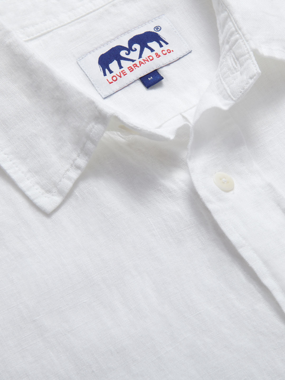 Men's White Manjack Linen Shirt close-up showing collar and label "Love Brand & Co."