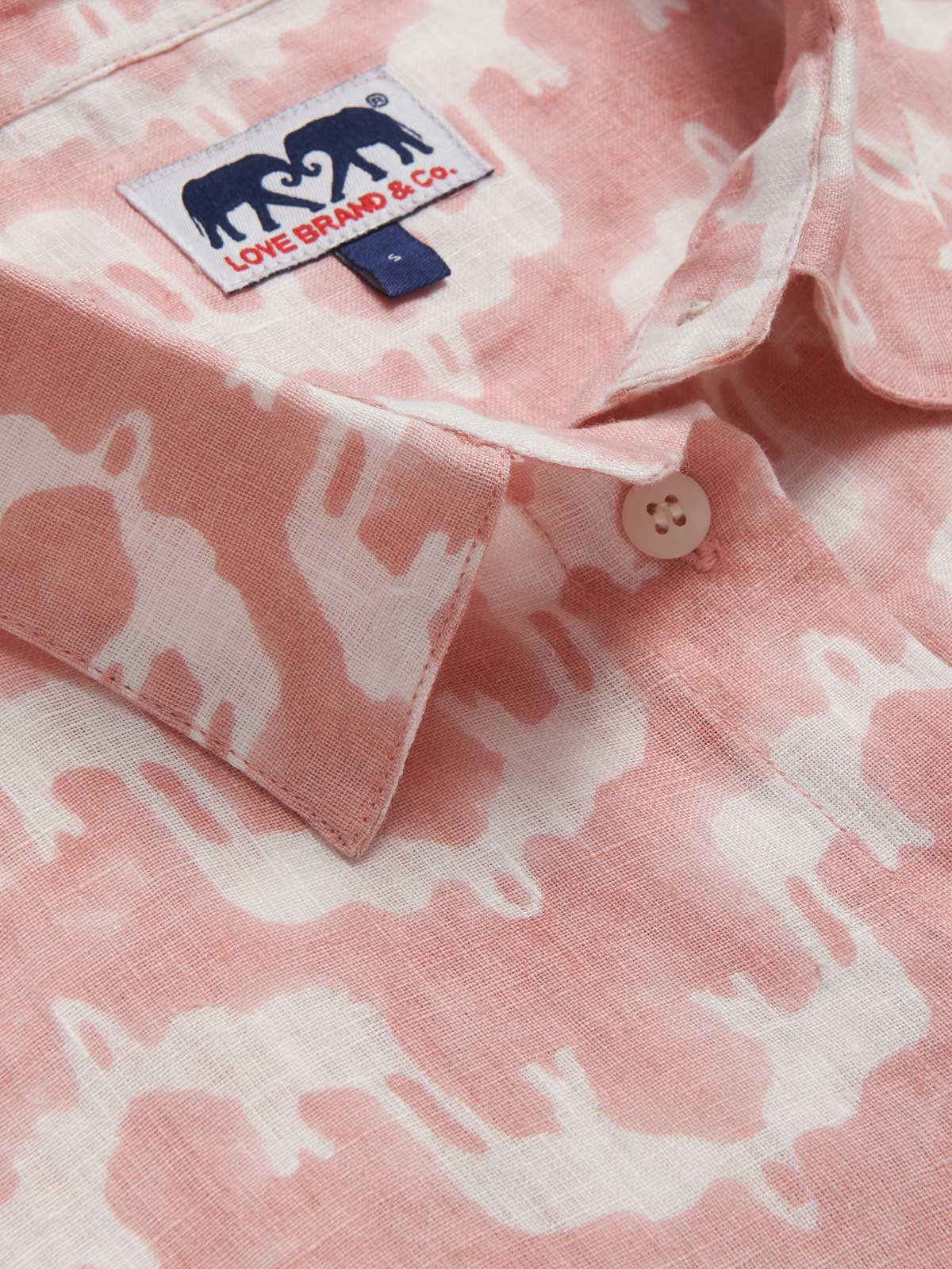 Womens Elephant Palace Strawberry Sapodilla Linen Shirt Dress detailed view. Pink elephant palace print midaxi dress with long sleeves and pockets.