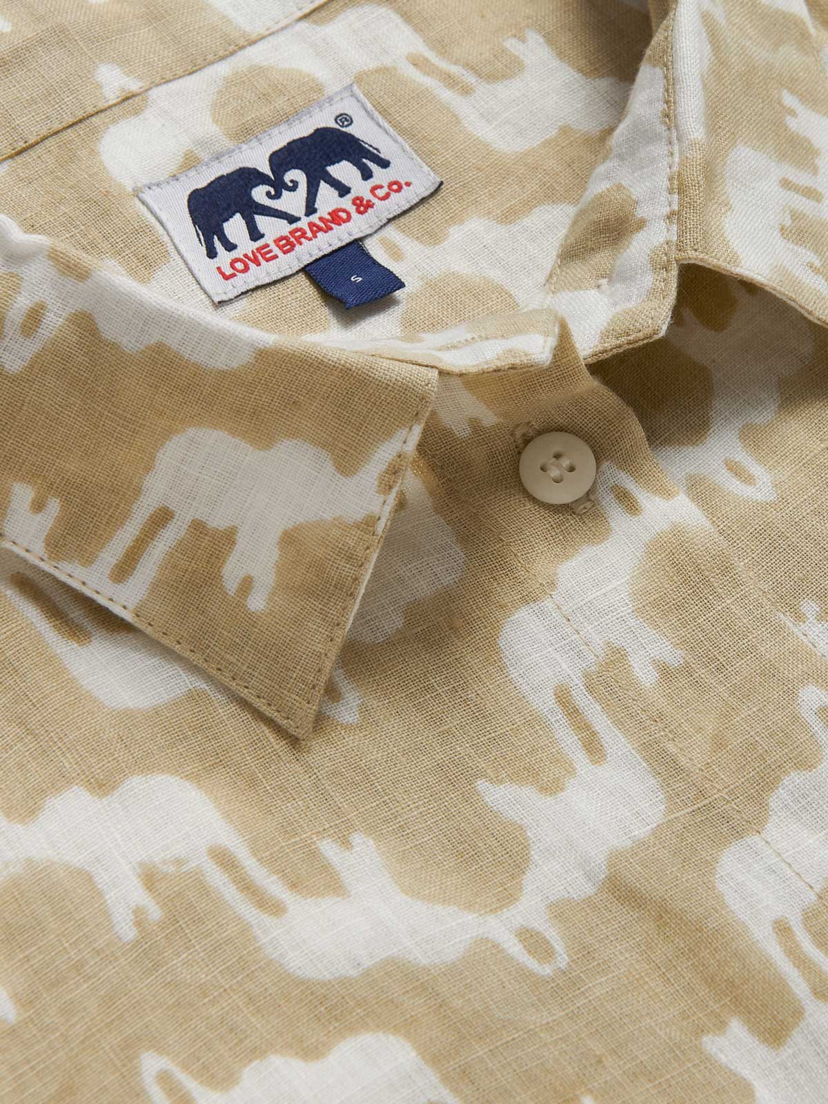 Womens Elephant Palace Coconut Sapodilla Linen Shirt Dress made from 100% linen in our elephant palace print. Close-up view of the collar of the beige and white colour midaxi dress with long sleeves.