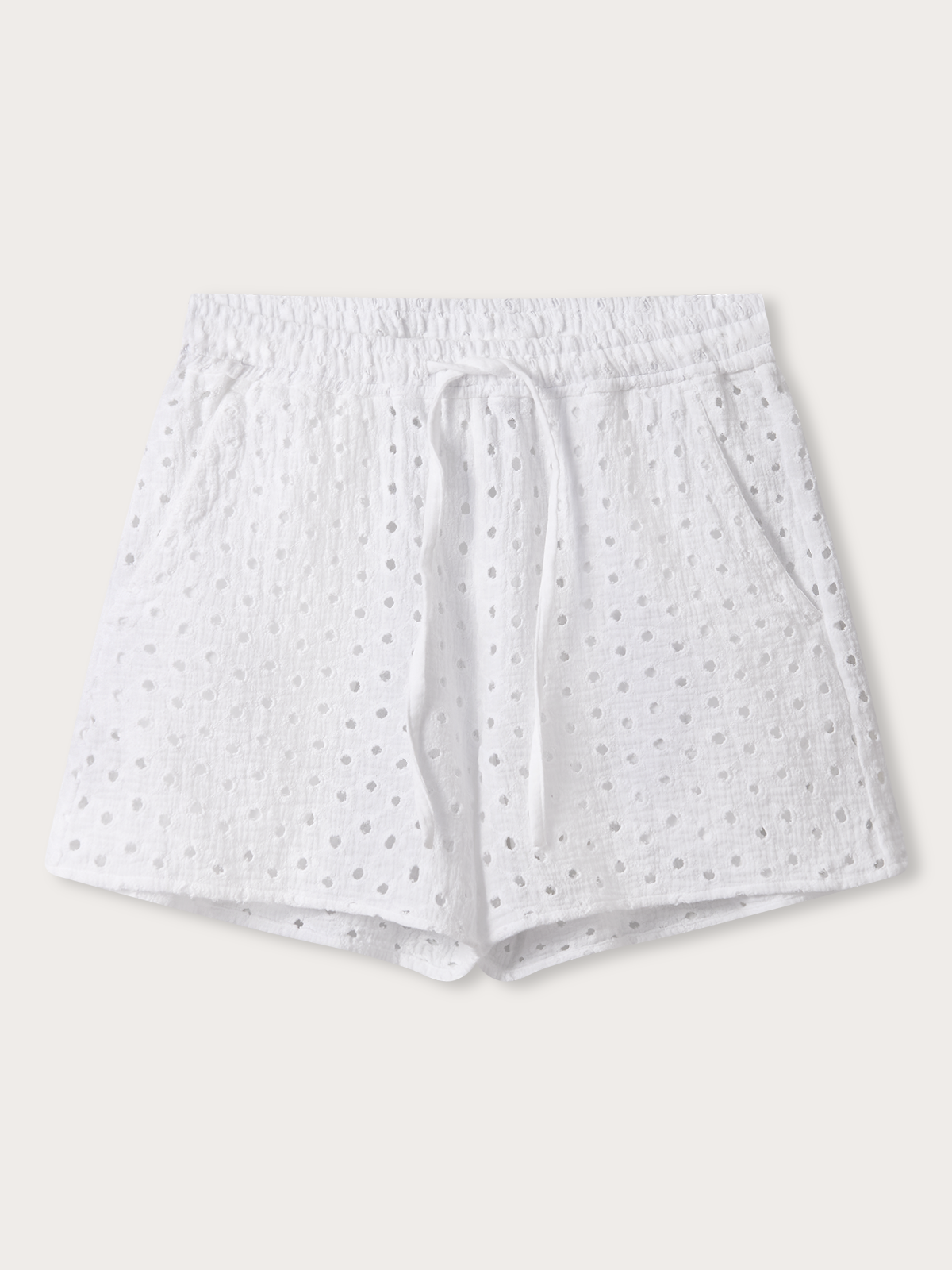 White shorts with small patterns on a light grey background