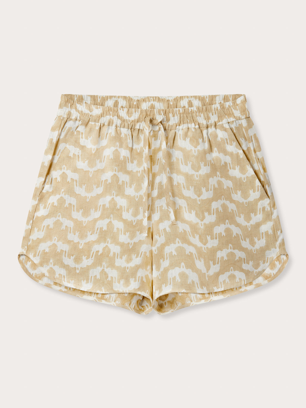 Front view of Womens Elephant Palace Coconut Musha Linen Shorts. White and beige shorts for women with elephant print. In a relaxed fit with elastic waist and drawstring. Finished with handy pockets.