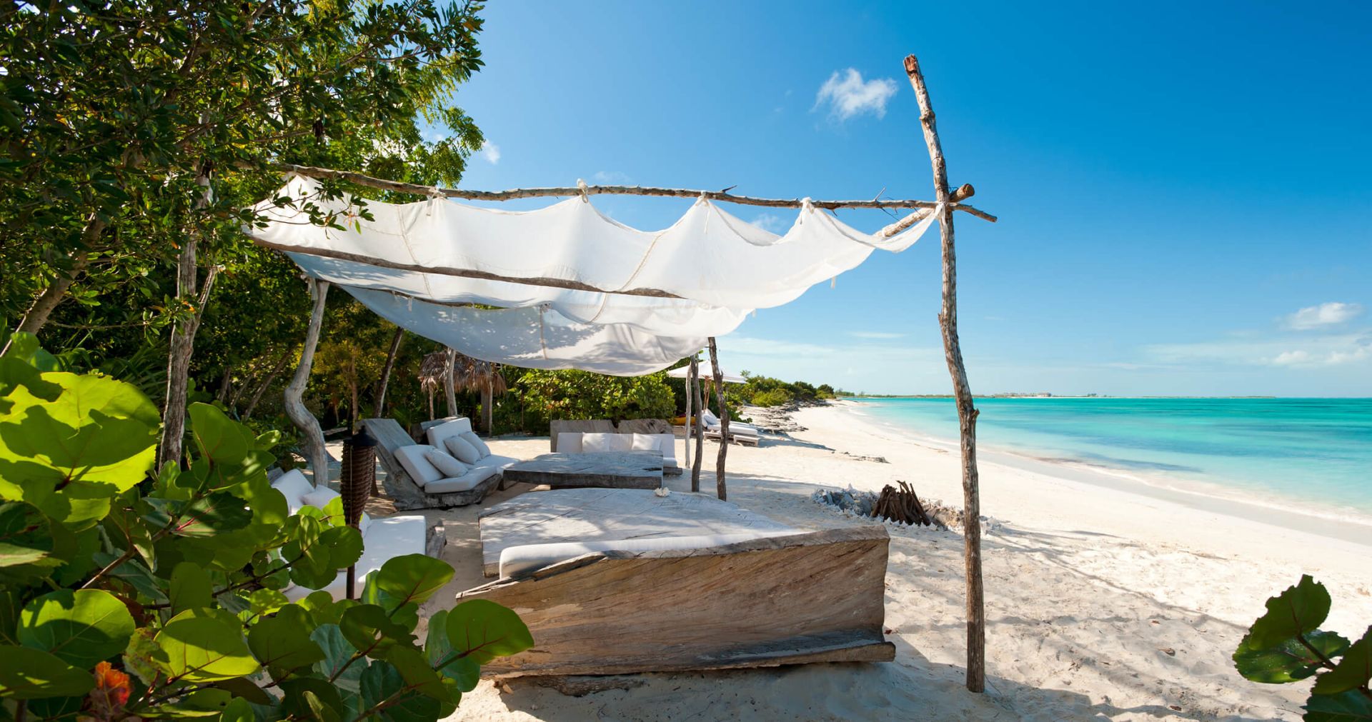Seats on the beach overlooking the sea at COMO Parrot Cay