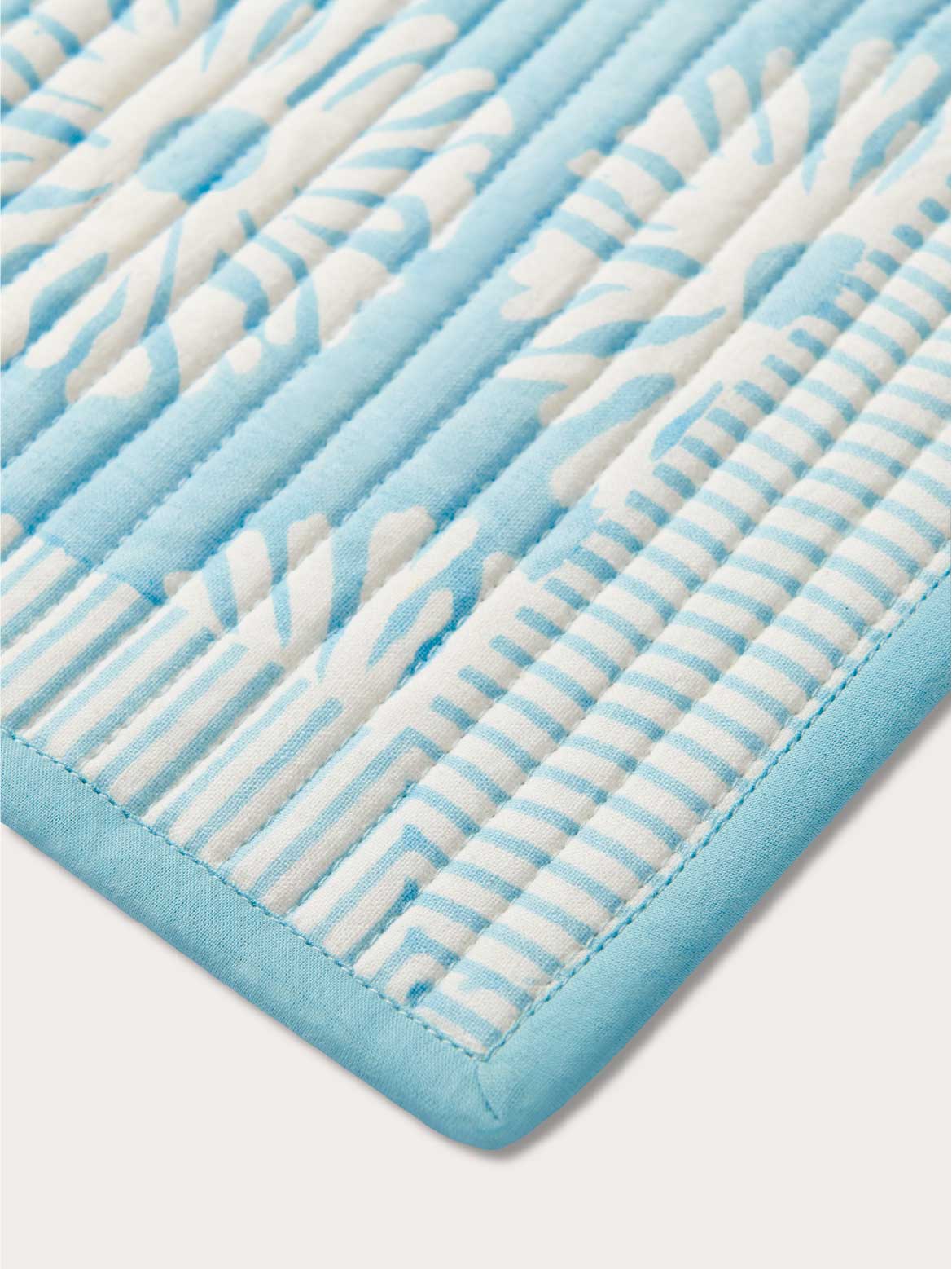 Close-up of a blue and white textured placemat