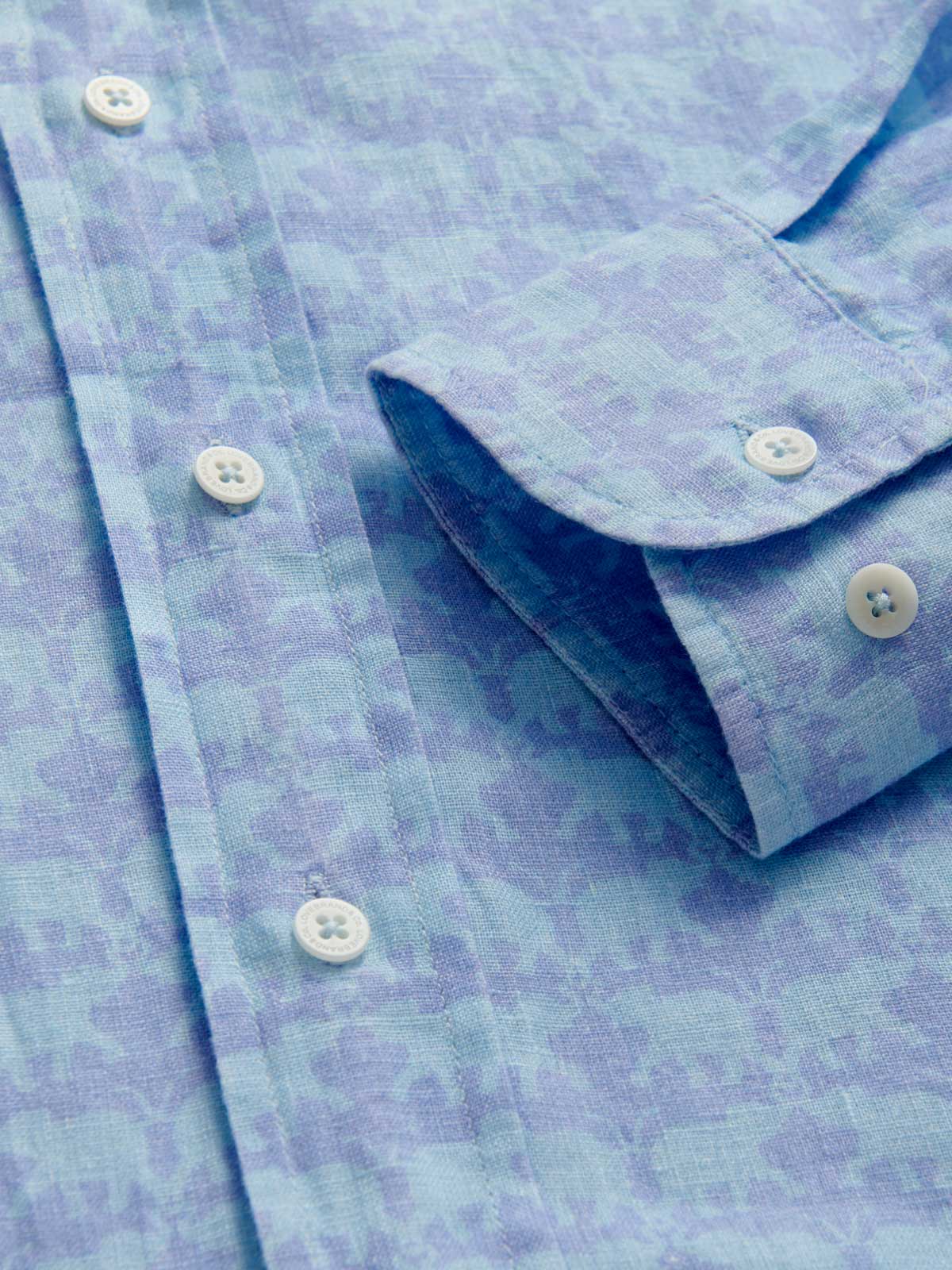 Close-up view of cuff detailing on Men's Elephant Dance Blue Abaco Linen Shirt.