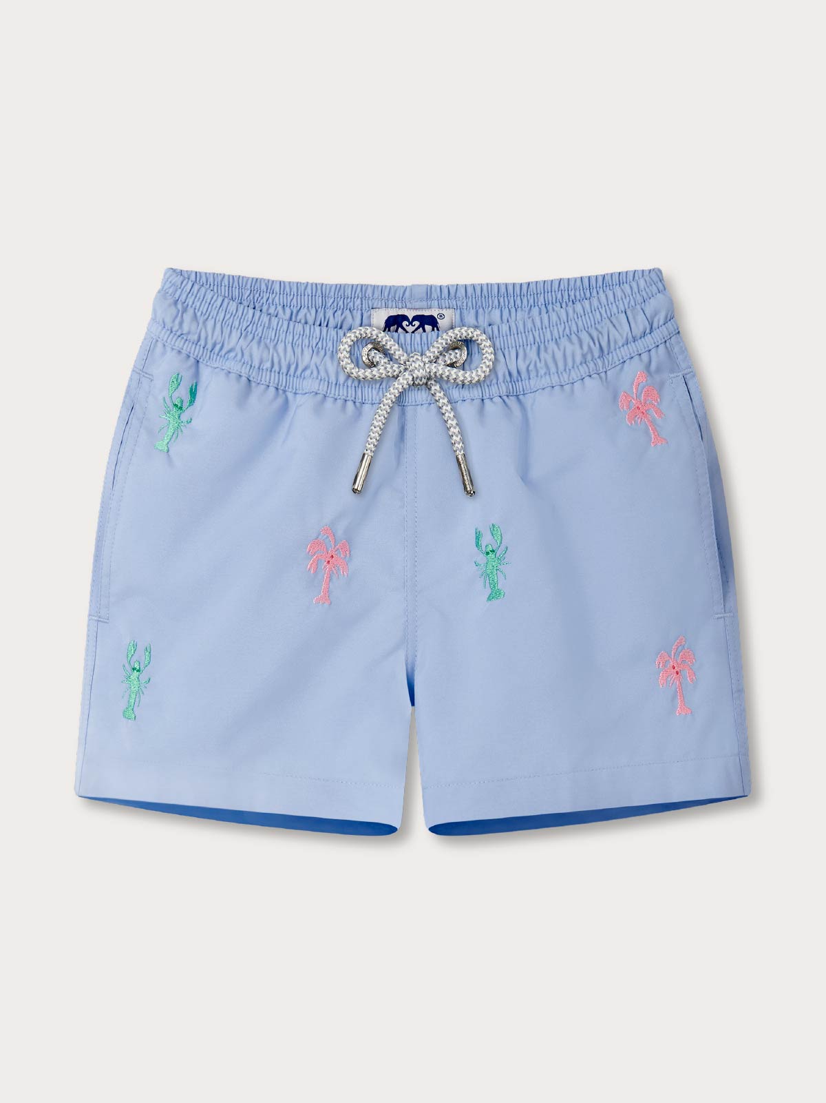 Blue embroidered swimming trunks for boys feature lobsters and palm trees.