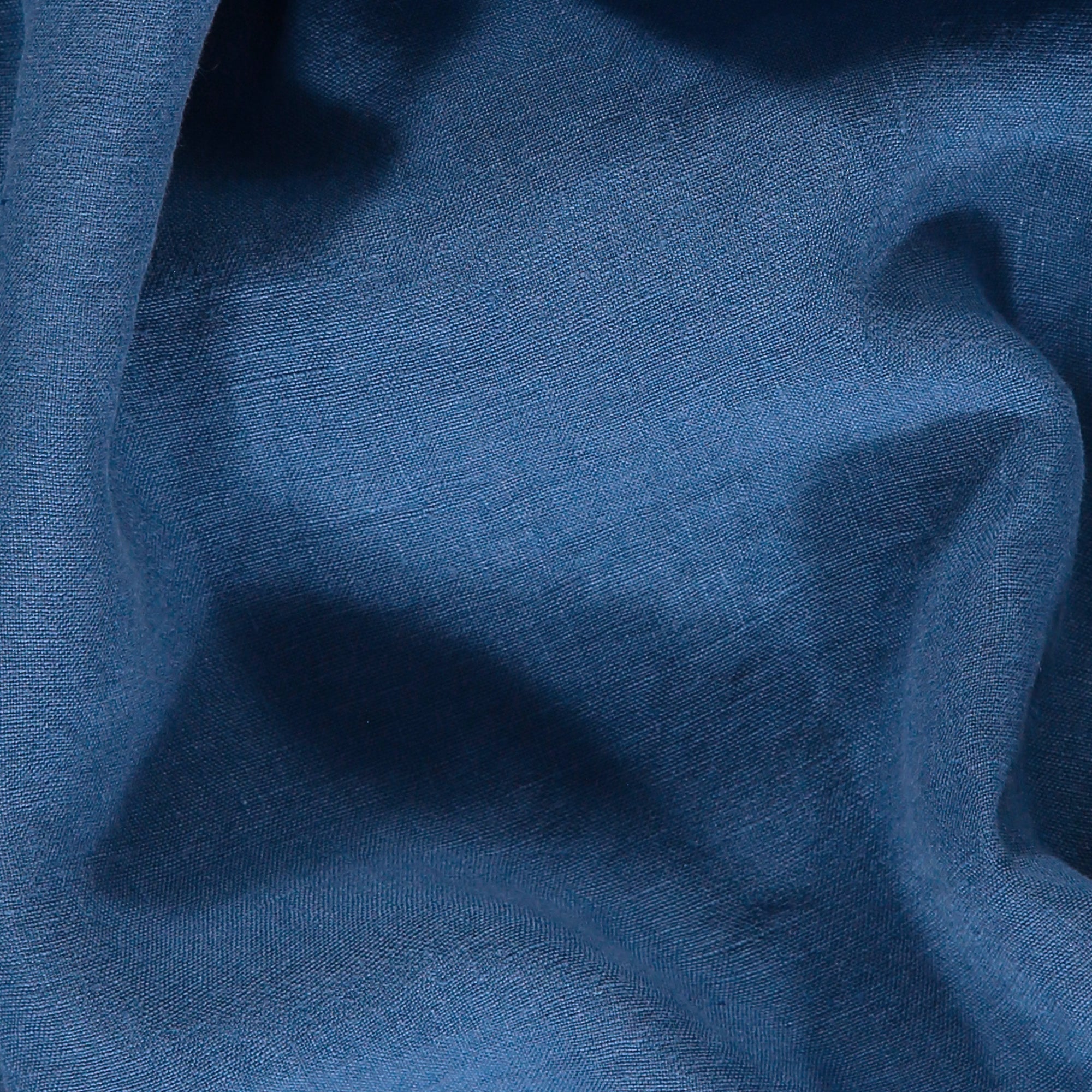 Close-up of blue chambray fabric used for Men's Chambray Burrow Linen Shorts.