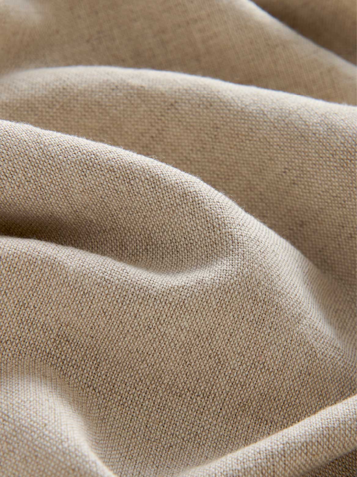 Close-up of beige fabric with a soft texture