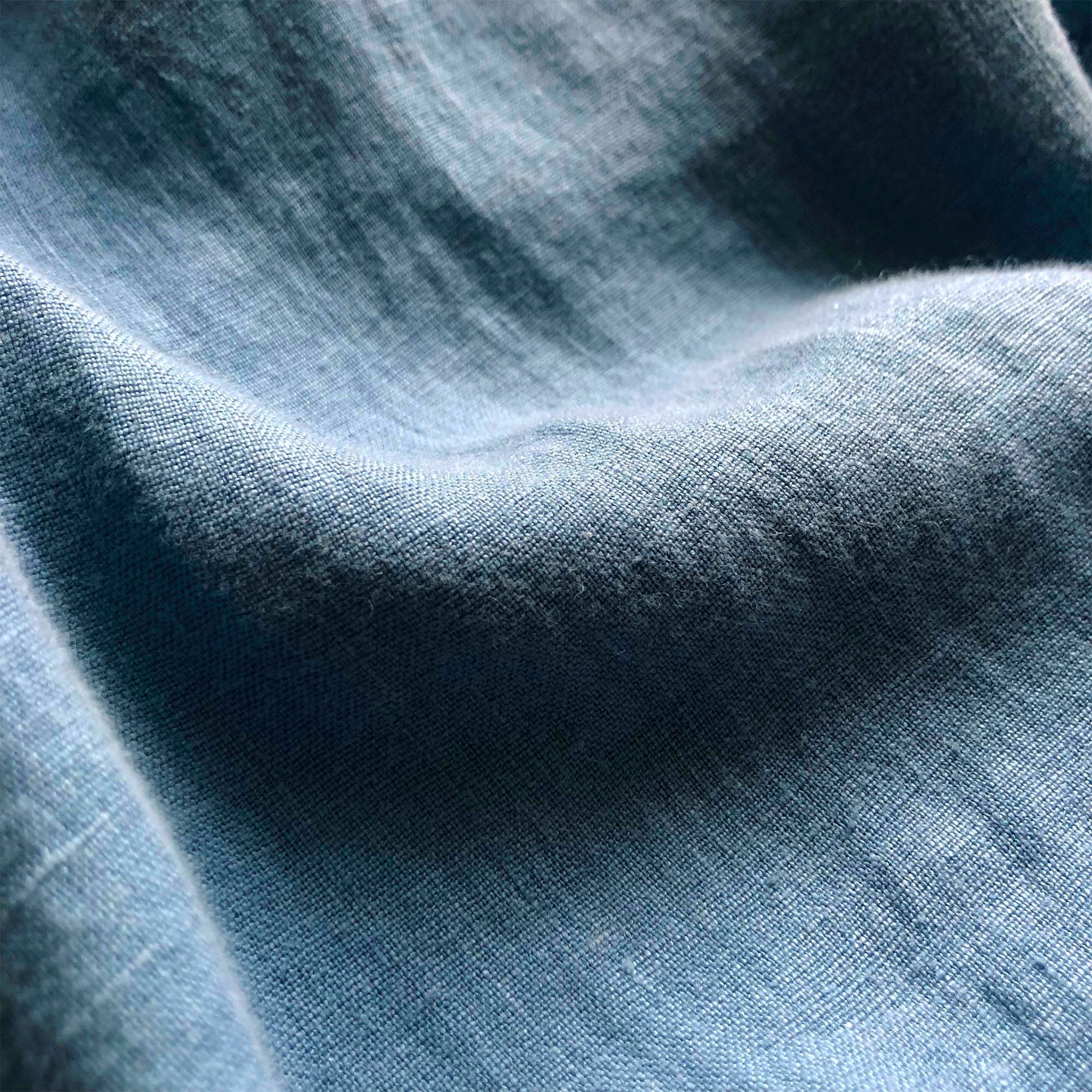 Close-up of Men's French Blue Randall Linen Trousers fabric showcasing its texture and quality.