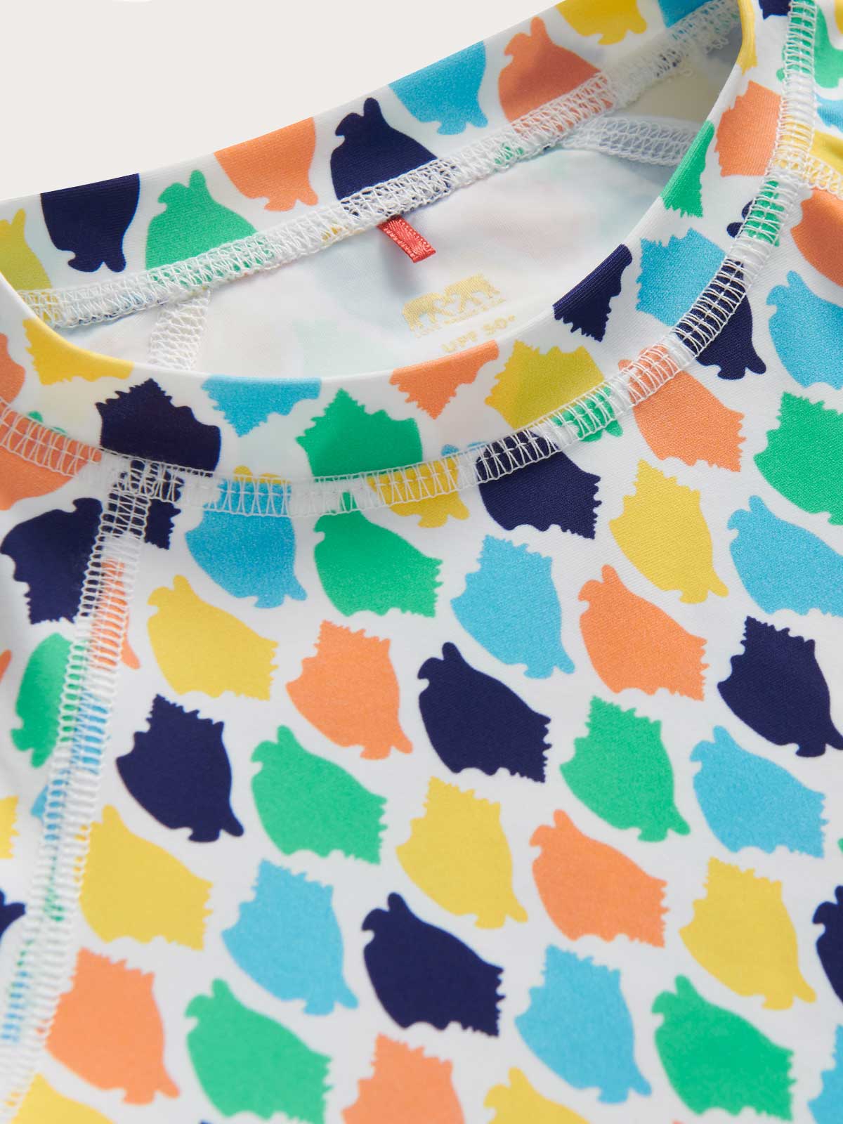 Colourful patterned rash vest close-up on a white background