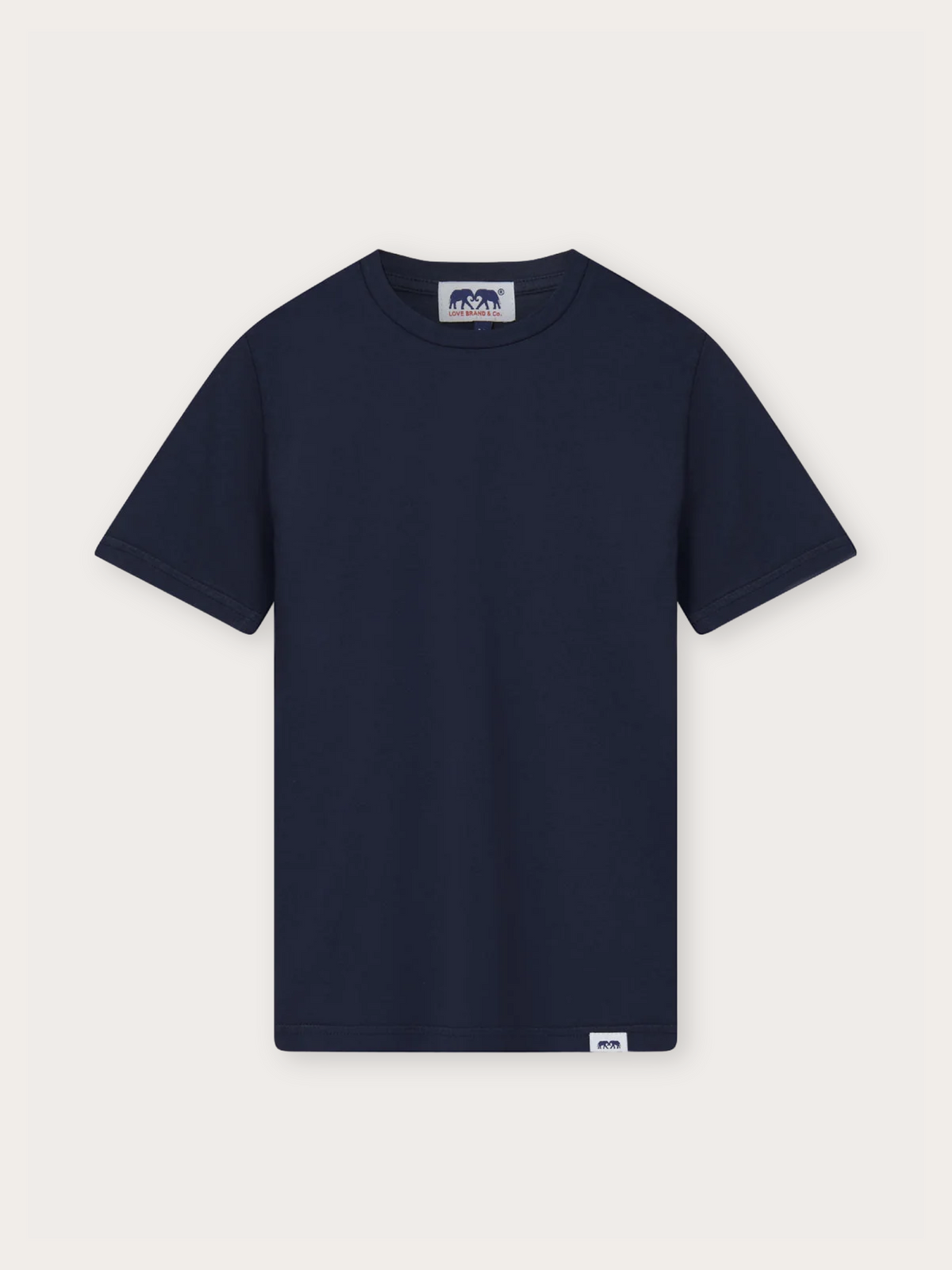 A navy blue short-sleeve crewneck t-shirt with a small white brand label on the bottom hem and a larger logo patch on the inner neck, displayed flat against a light off-white background.