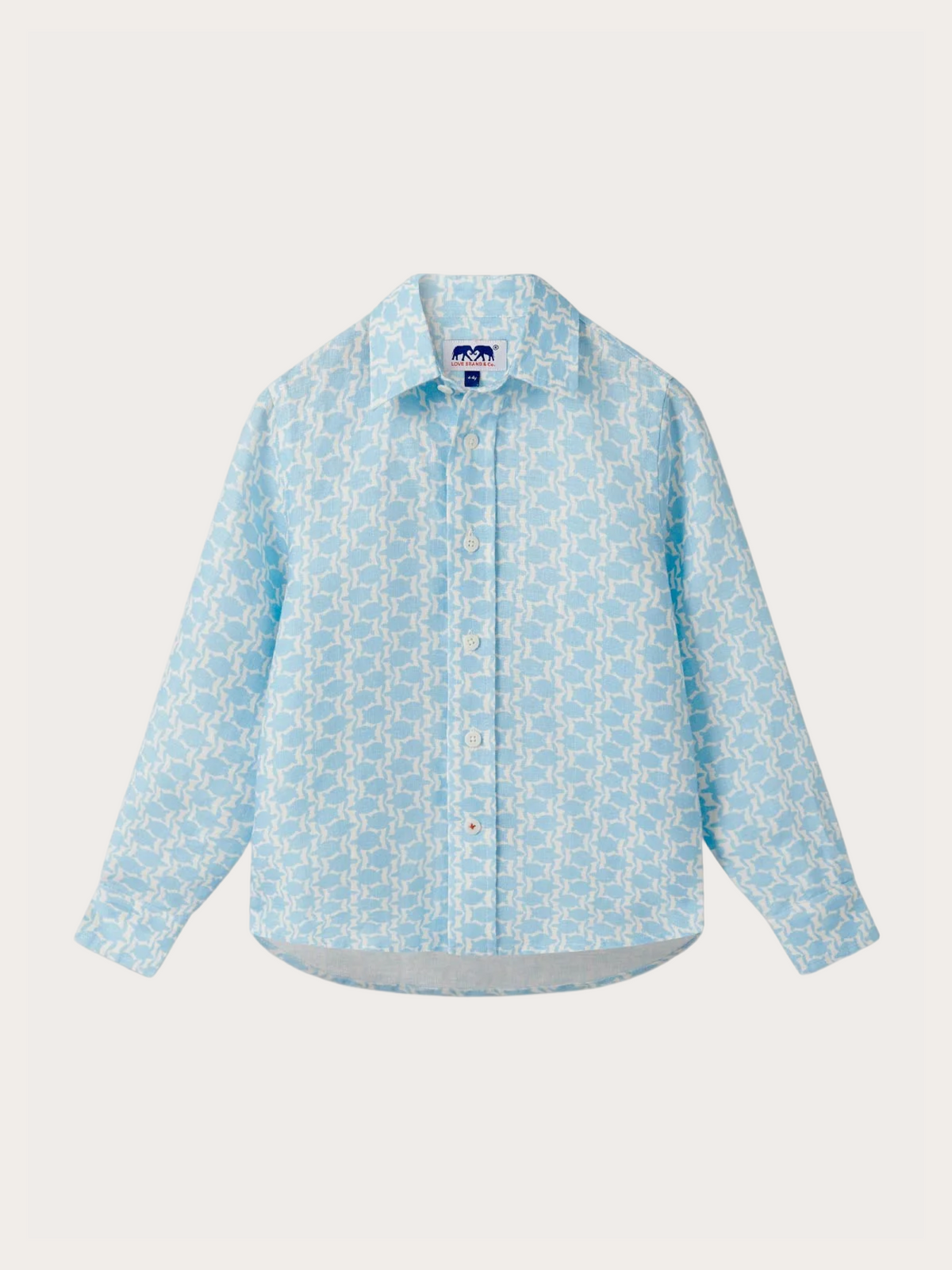 A light blue long-sleeve button-up shirt with a repeating white geometric monogram pattern, shown flat against a light off-white background.