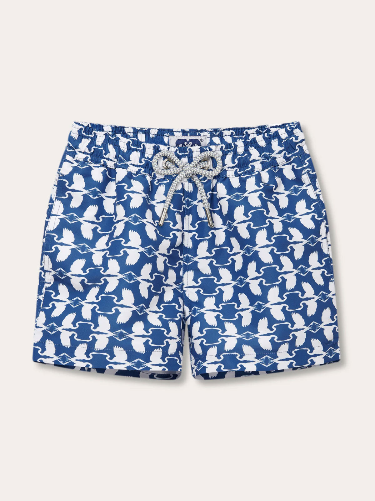 Boys white heron Staniel swim shorts designed by LOVE BRAND & Co., featuring a pattern of Great White Herons in white and deep blue.