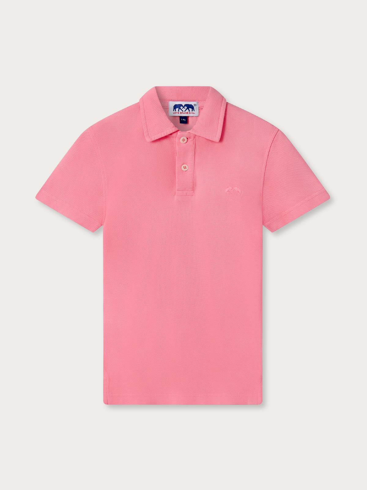 Kids pink polo shirt on a light background.