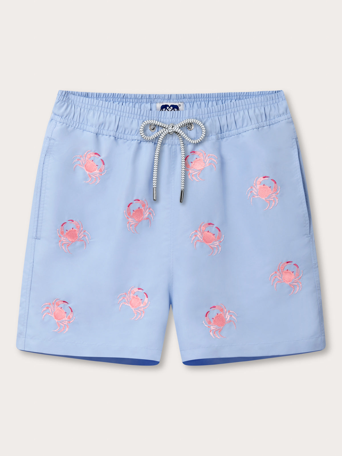 Light blue shorts with pink crab patterns on a light grey background.
