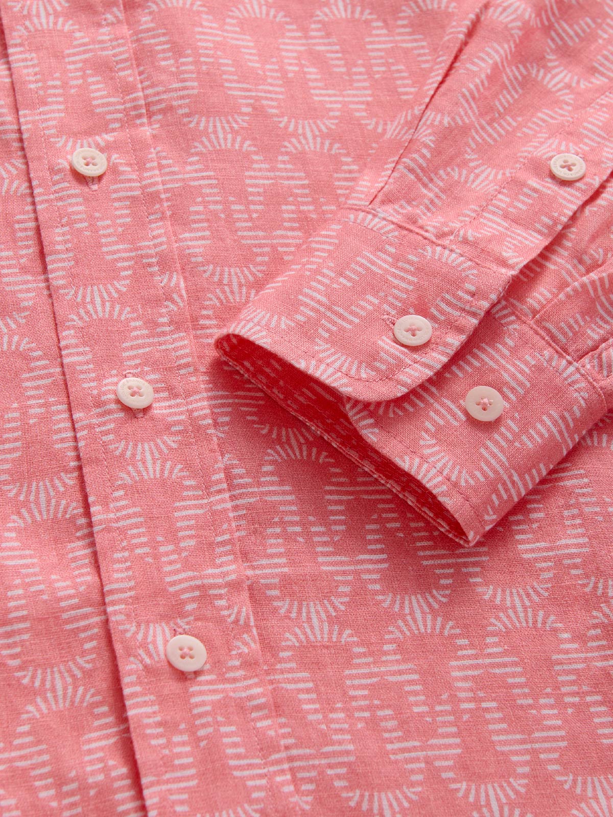 Close-up of a pink patterned shirt with sleeve details
