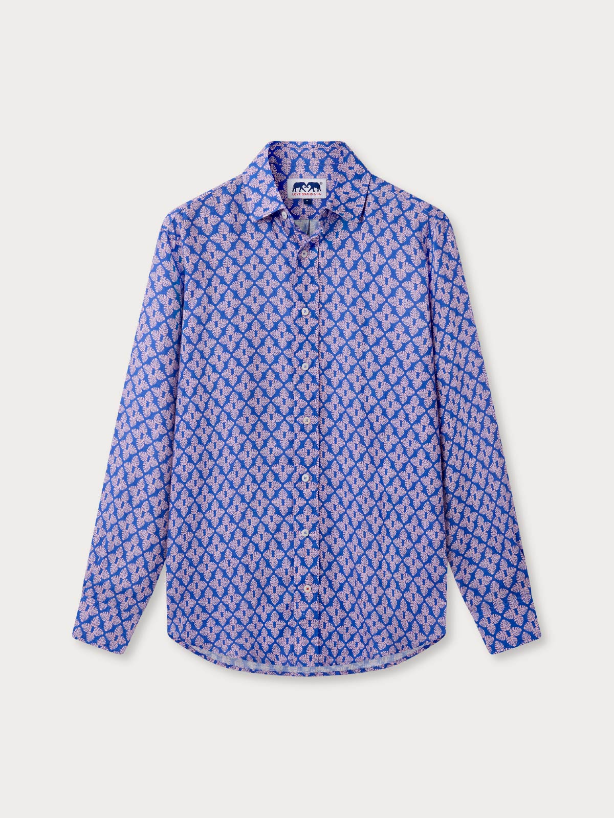 Front view of men's palm paradise linen shirt. A blue patterned linen shirt with a tropical print and long sleeves.