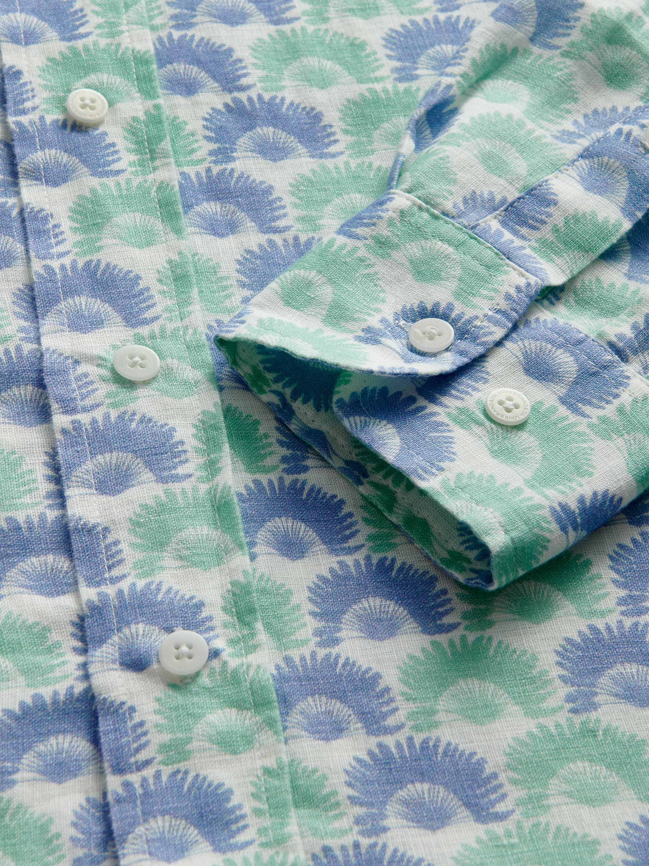 Close-up of a patterned shirt with blue and green design