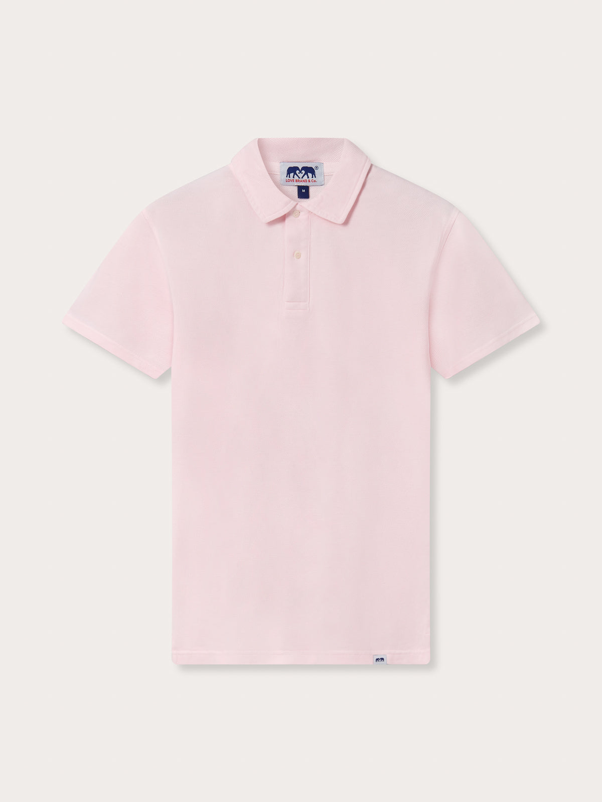 A men's pastel pink polo shirt with a classic design, including a collar and short sleeves.