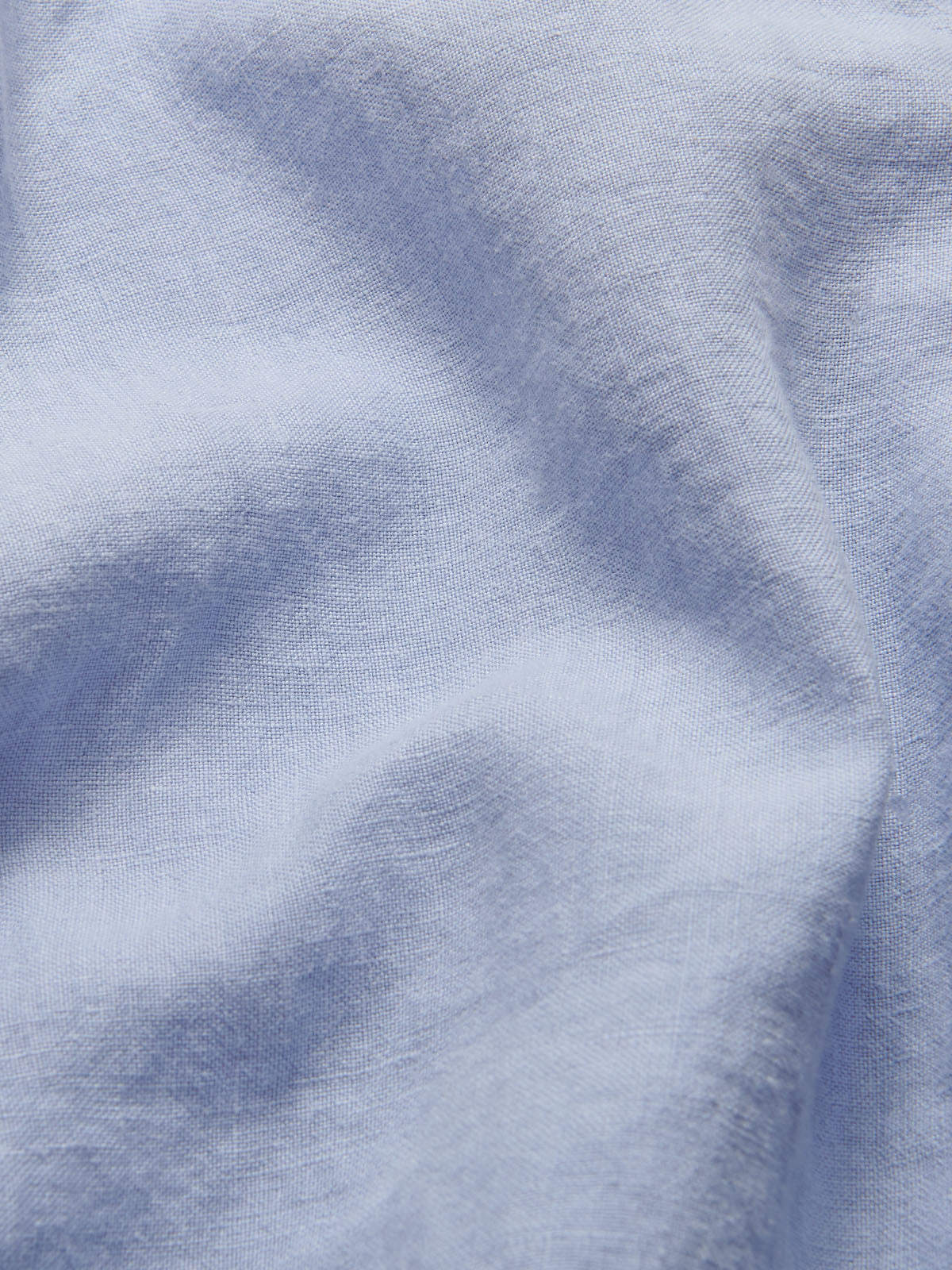 Detailed view of Men's Sky Blue Joulter Linen Shorts. Blue linen shorts with 2 pockets and drawstring waist in a relaxed fit.
