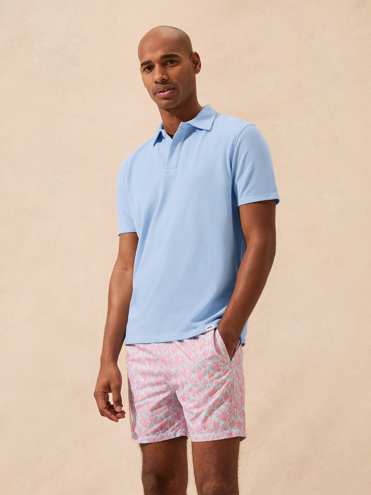 Man wearing a light blue polo shirt