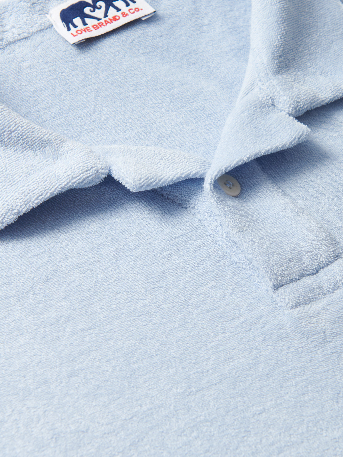 Powell Mens Sky Blue Terry towelling Polo Shirt close-up view.