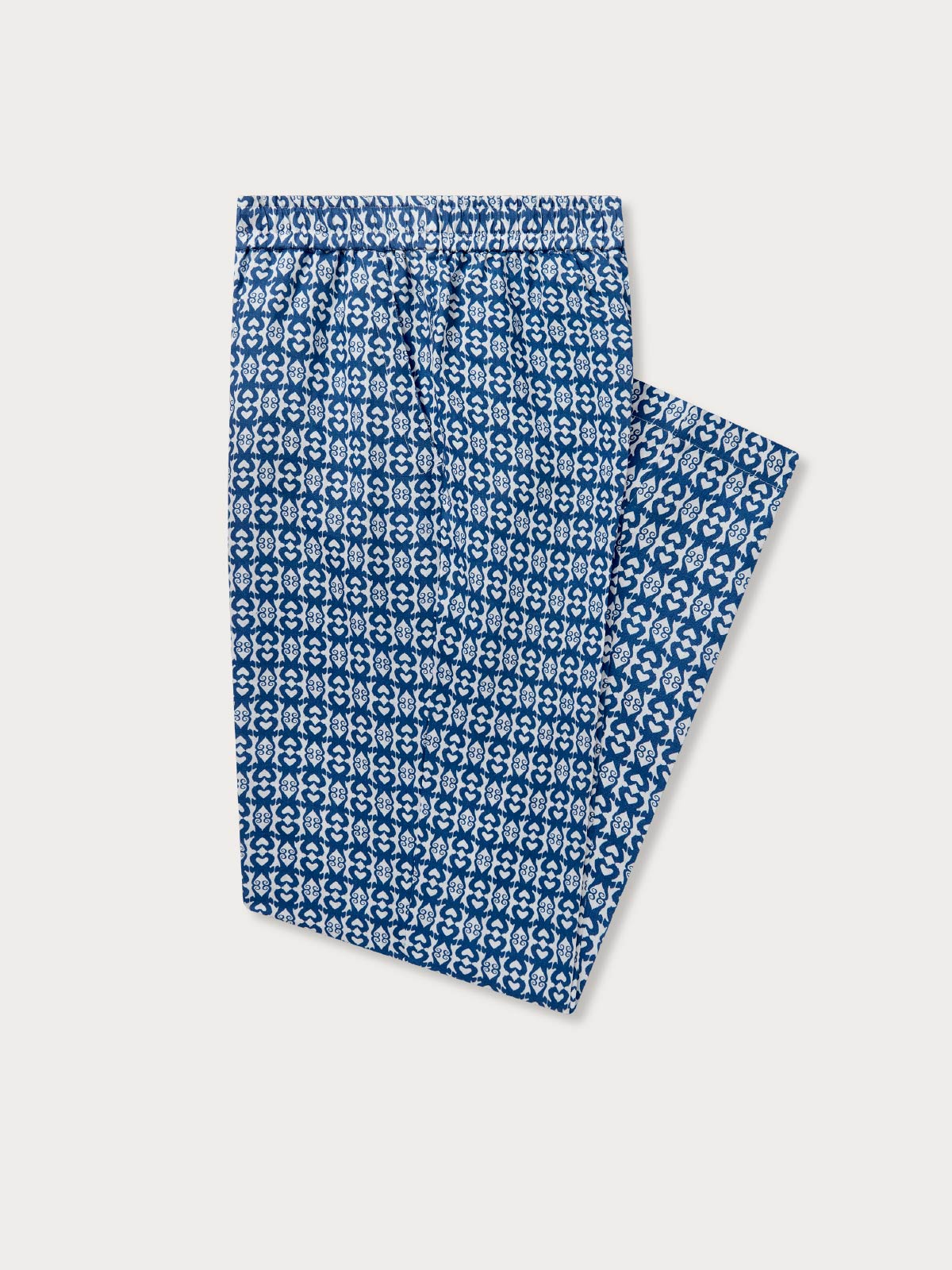 Blue patterned linen trousers on a white background