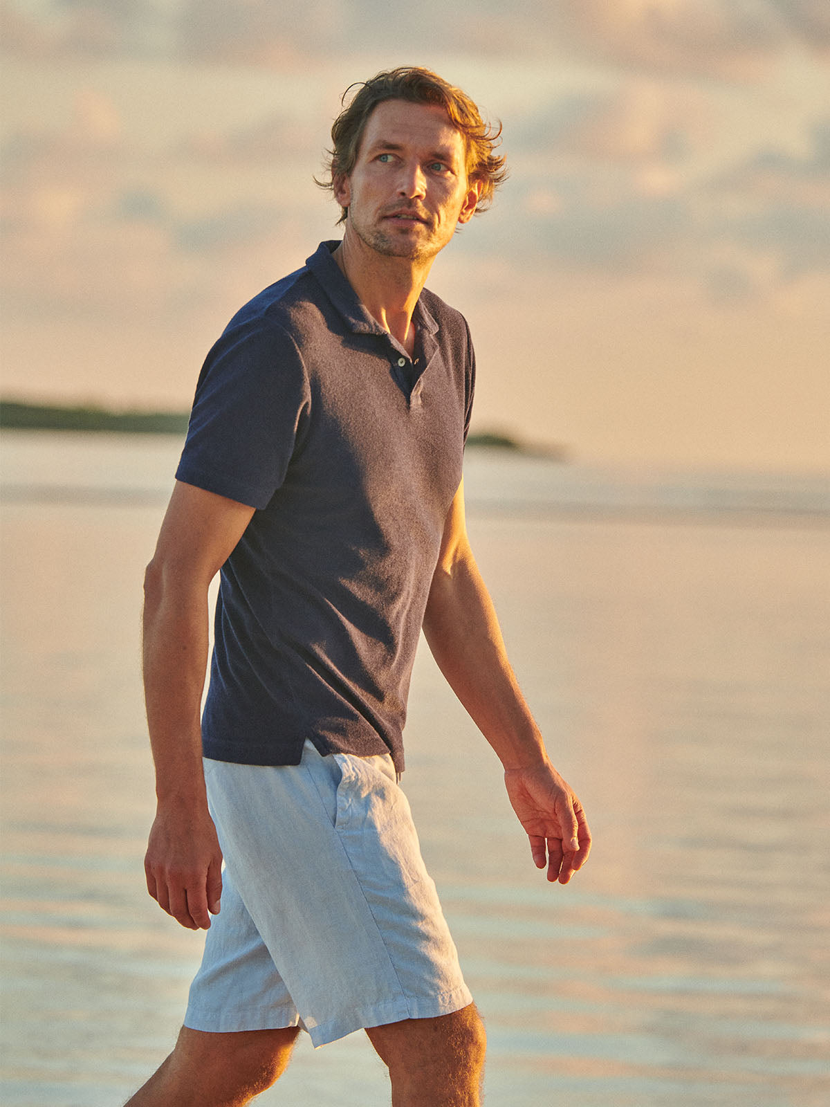 mens resort wear styled look showing model wearing mens beachwear and a pair of mens designer swim shorts