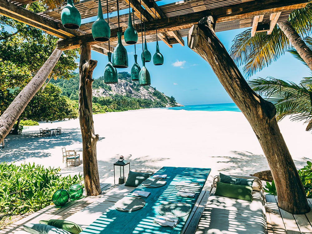 outdoor dining table at North Island Seychelles