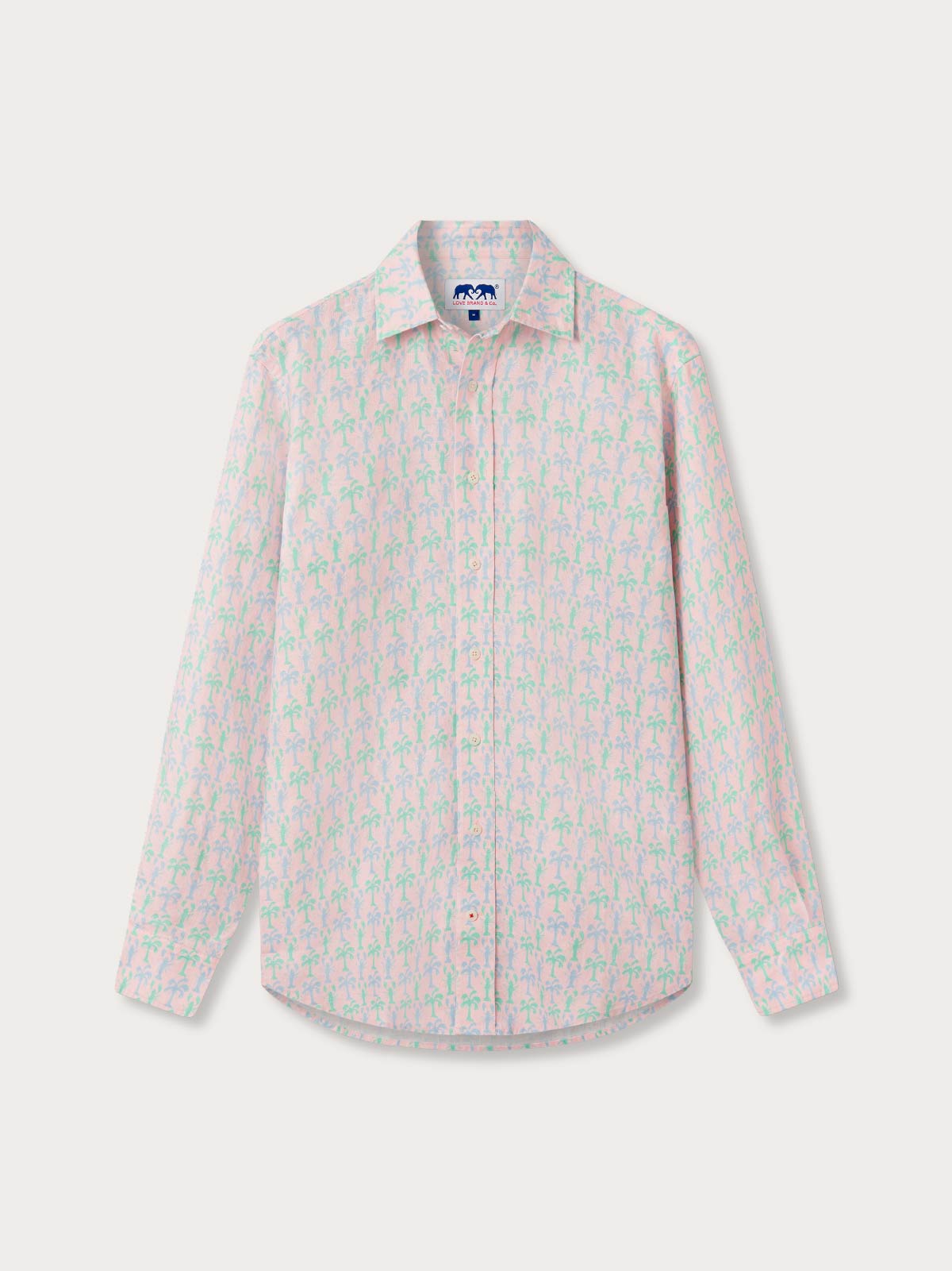 Long-sleeve pink shirt with a tropical print on a white background.