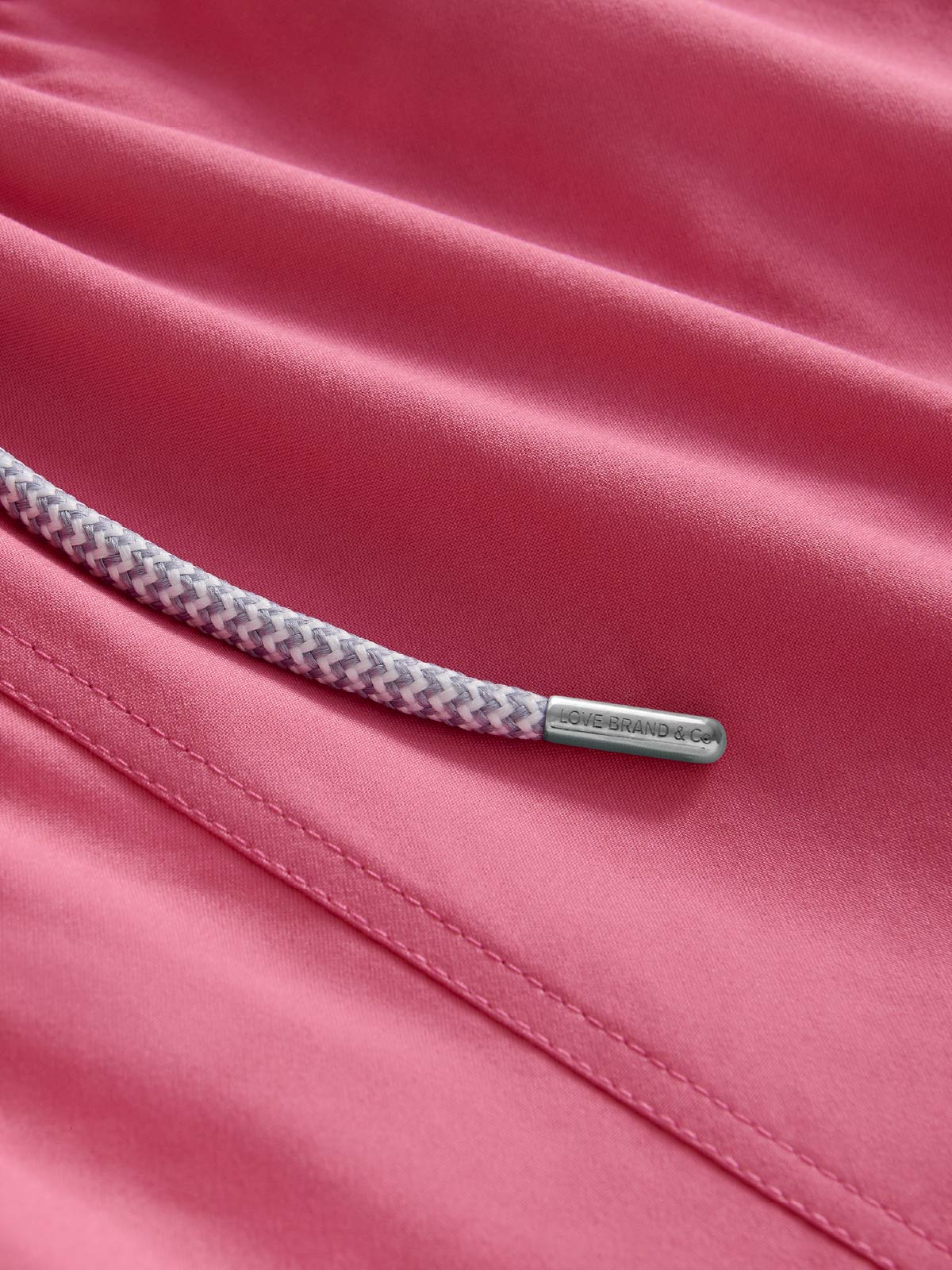 close-up fabric view of mens red swim shorts