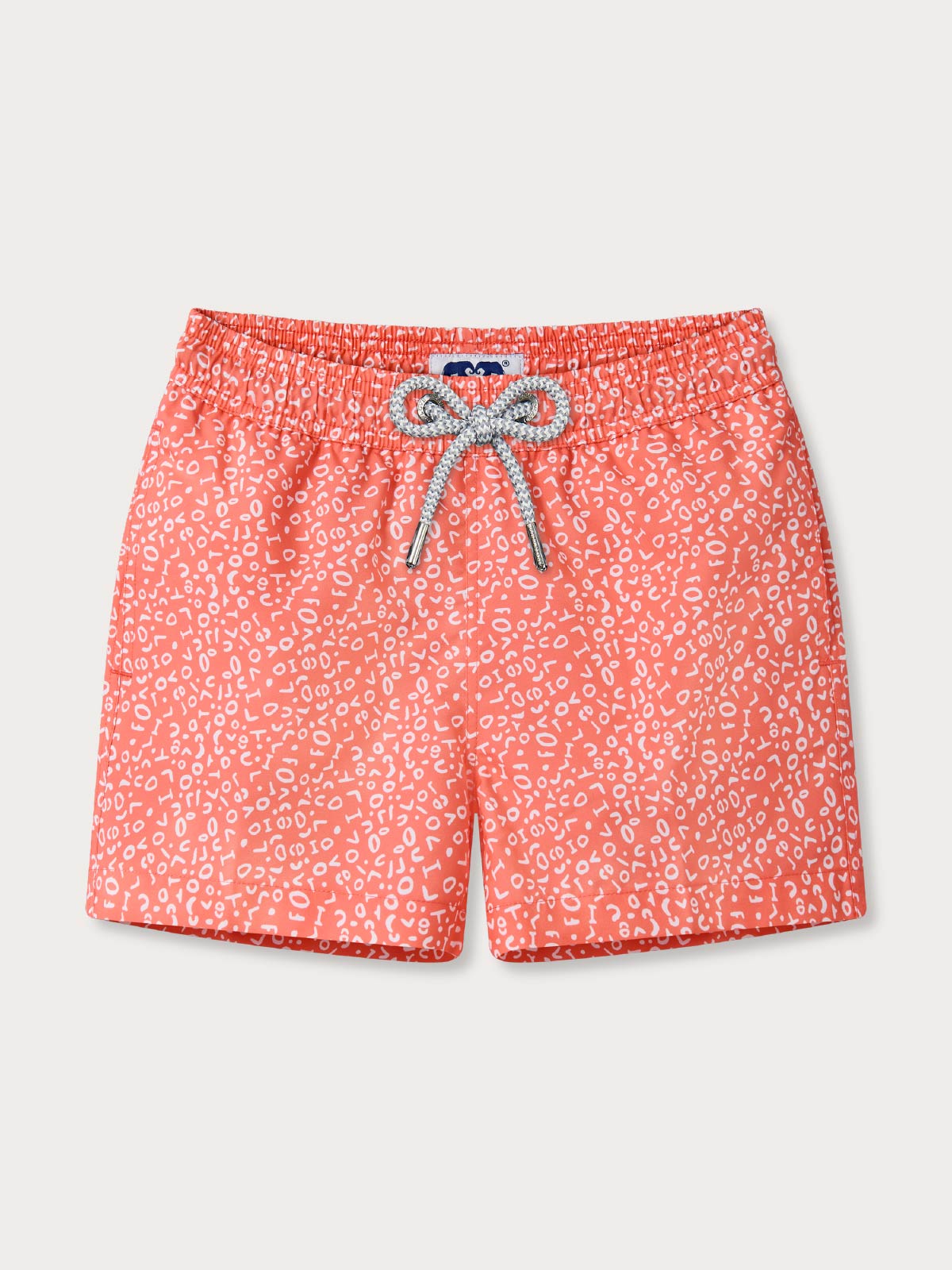 front view of kids patterned swim shorts in a red fabric with drawstring waist.