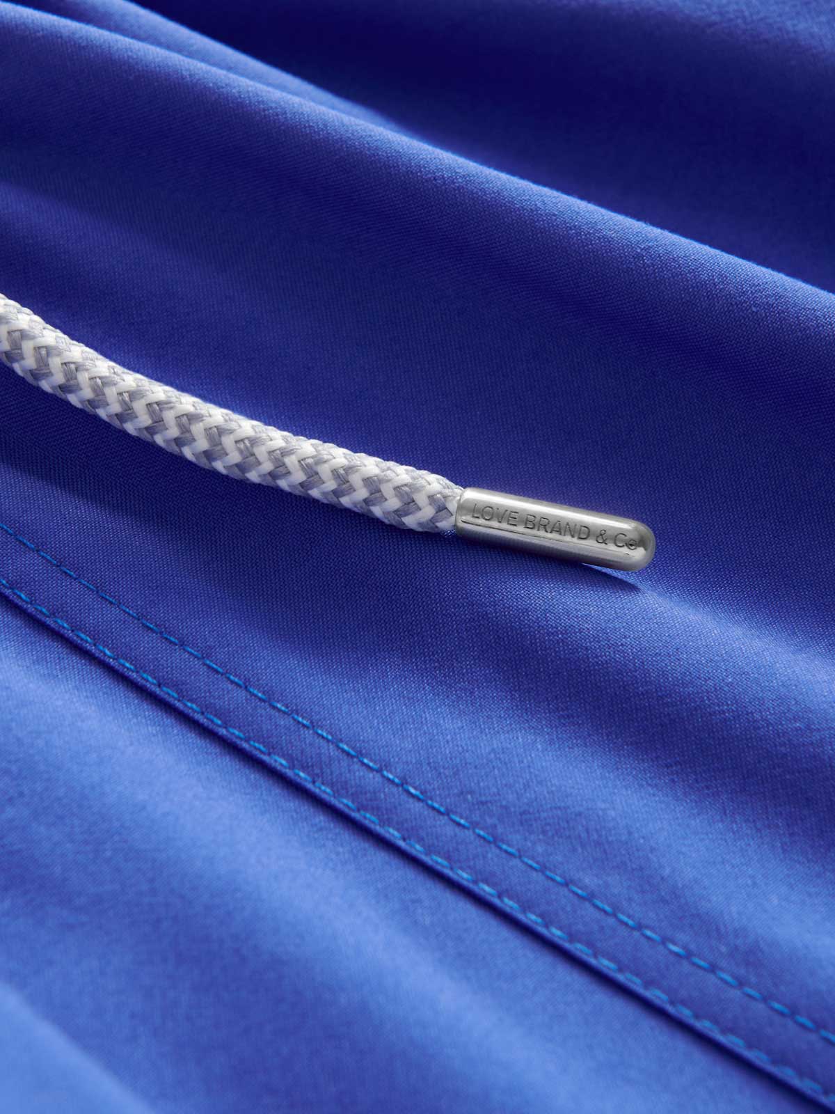 close-up view of Men's Majorelle Blue Staniel Swim Shorts. Swimming shorts blue by love brand.