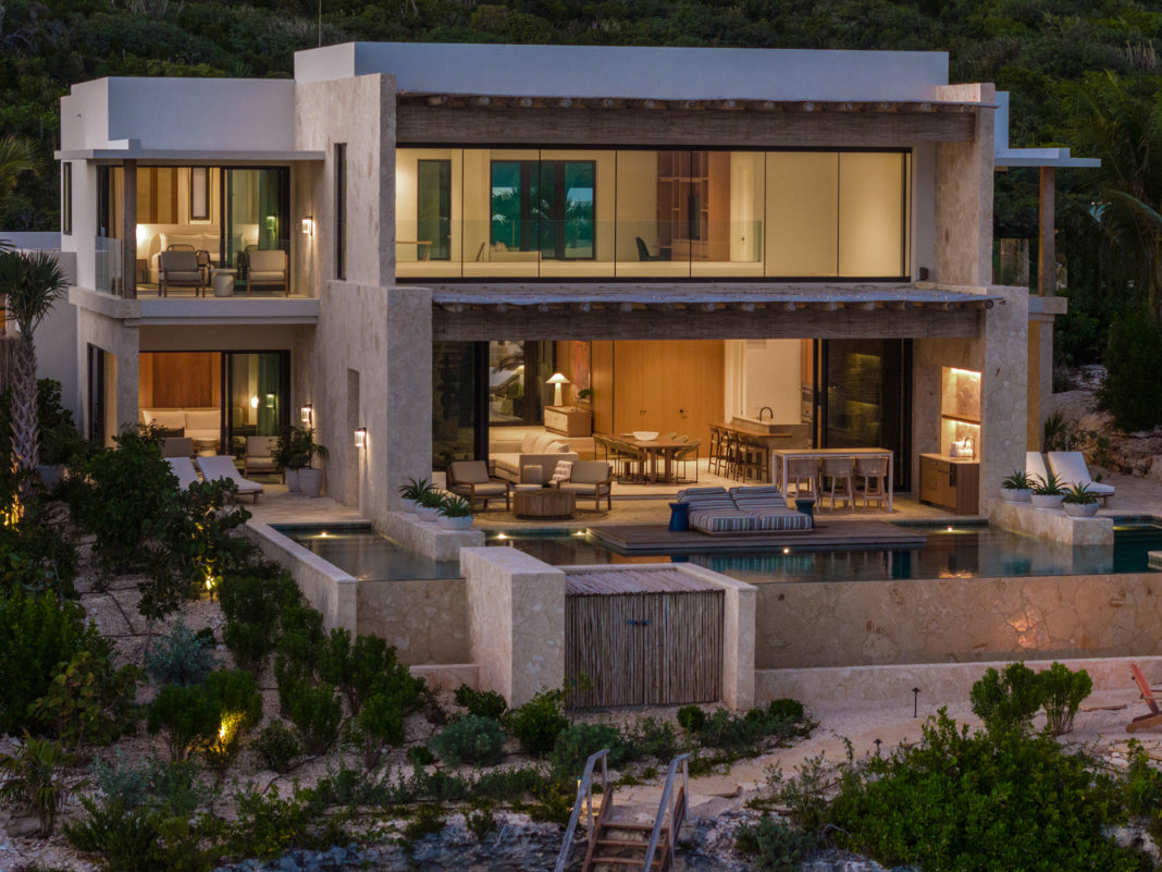 Modern house at The Strand with a pool and outdoor furniture at night