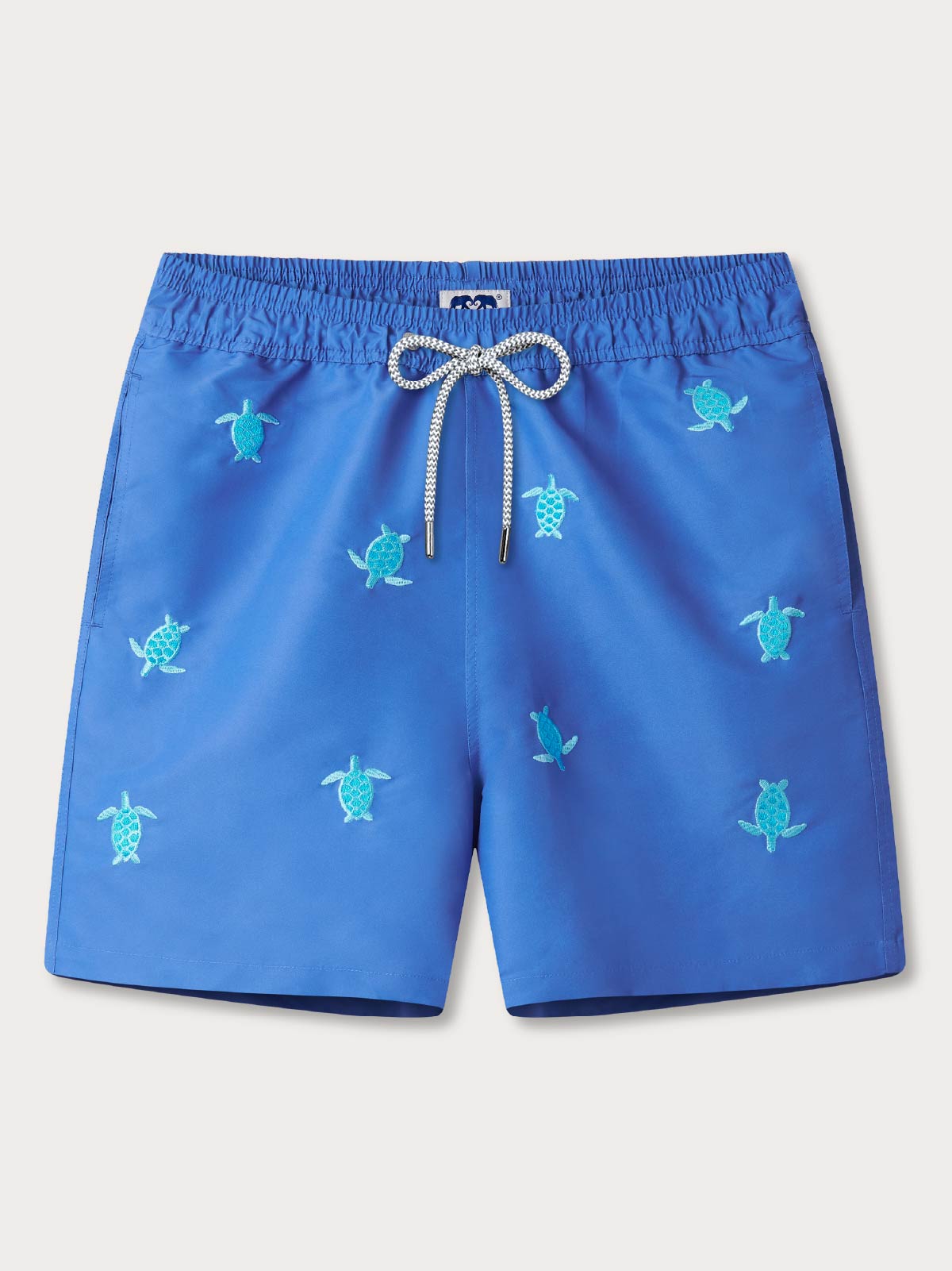 Front view of men's turtles hold on embroidered swim shorts showing drawstring waist and blue fabric.