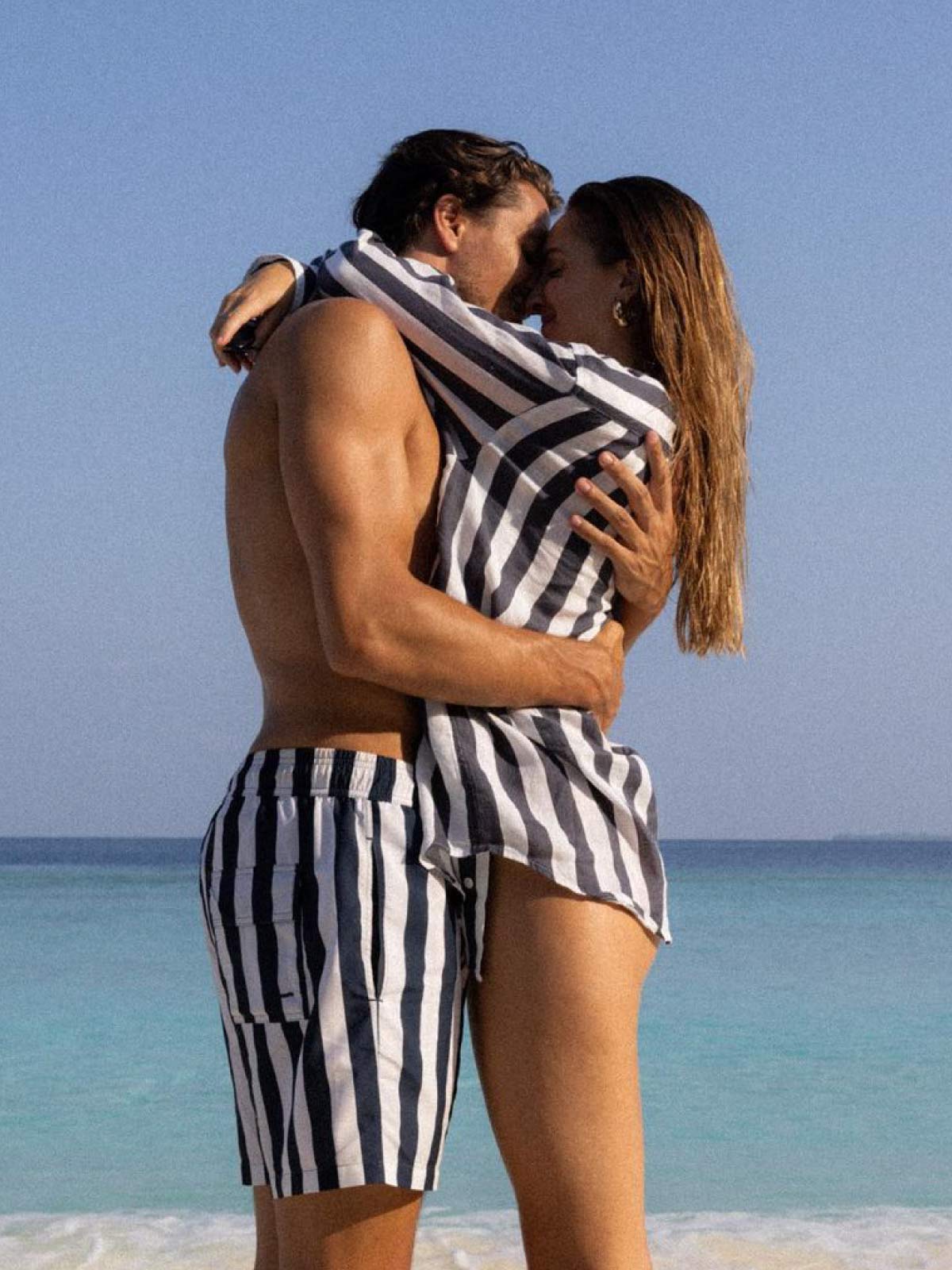 Couple in mens beachwear by mens swimsuit brands love brand & co.