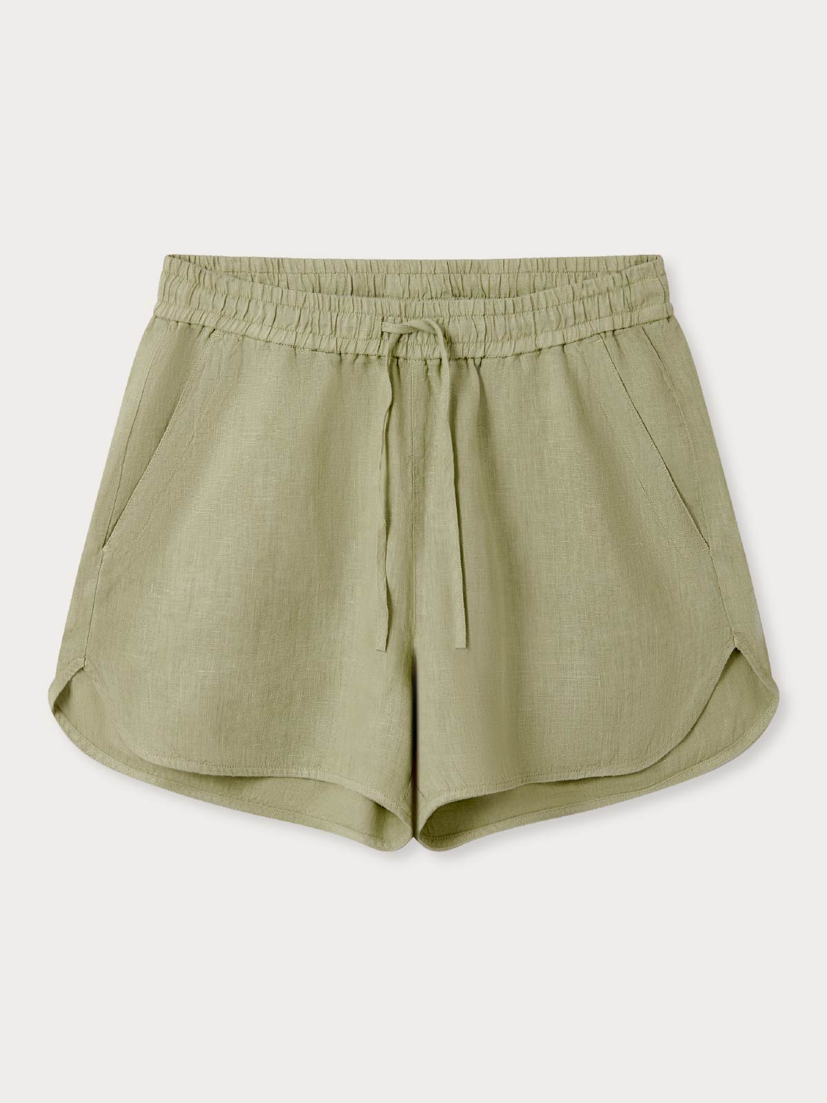 Green linen shorts on a light grey background