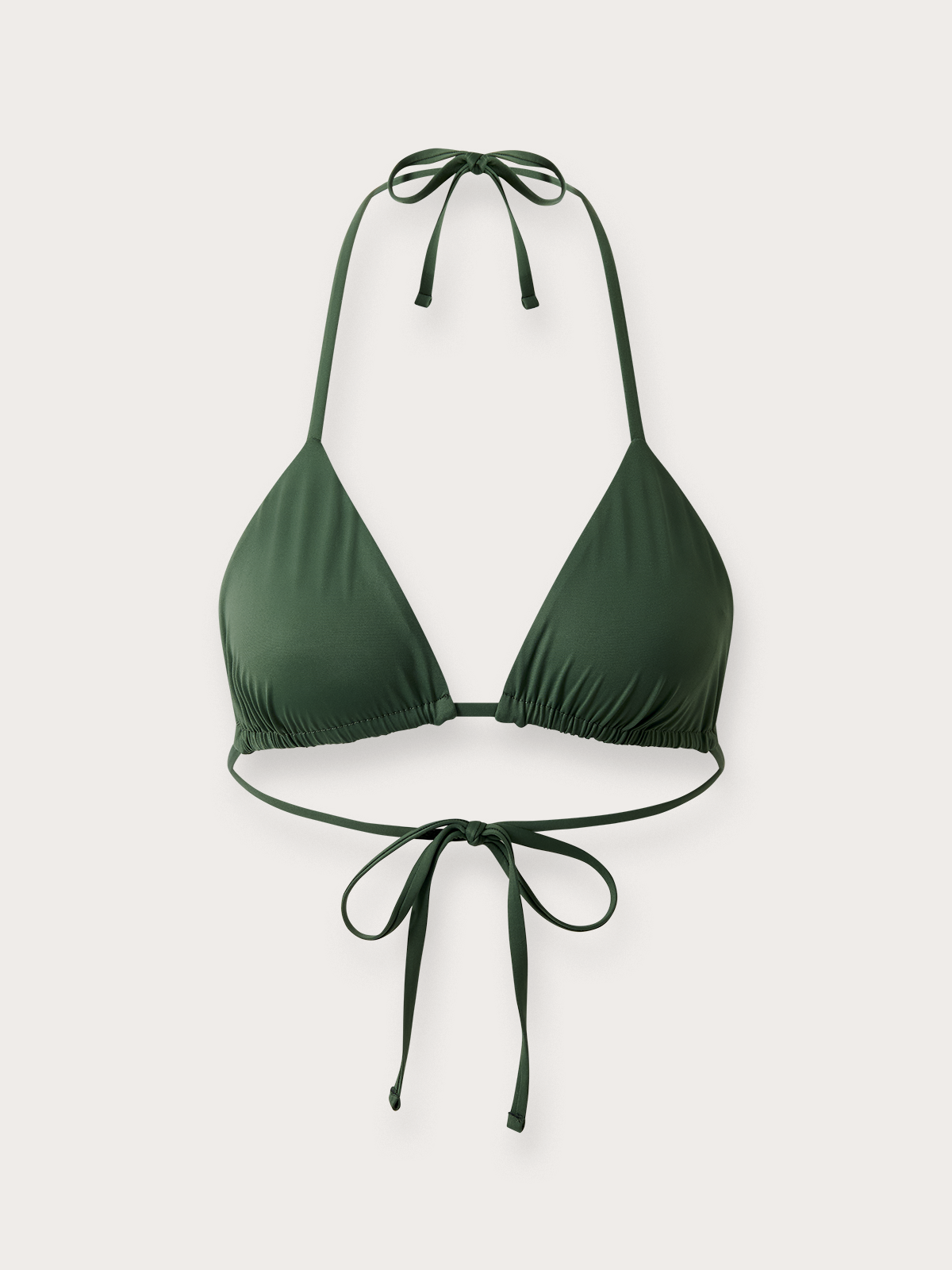 Green bikini top with halter straps on a light grey background