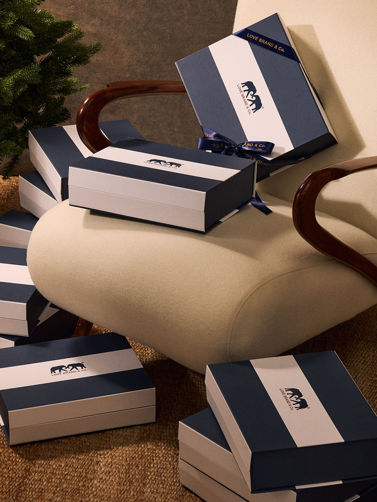 Stacked blue and white boxes with a logo on a textured surface